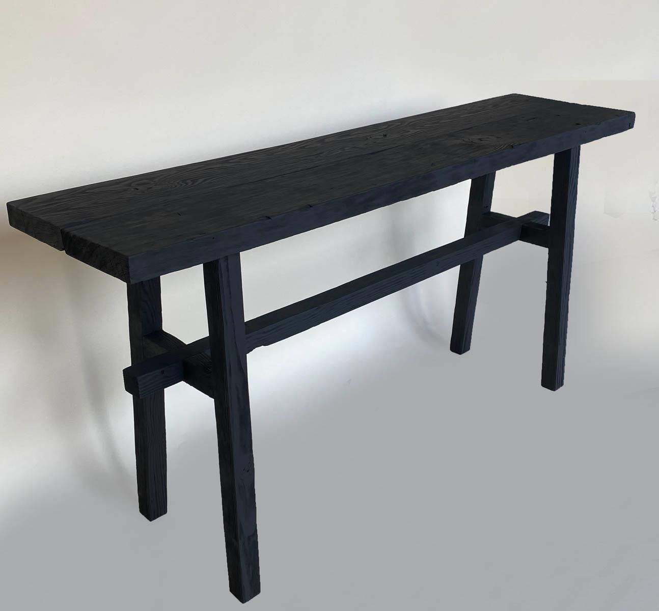 A one of a kind high stretcher console made from reclaimed Douglas fir with black finish. Modern and clean style, but rustic. Two inch think top.