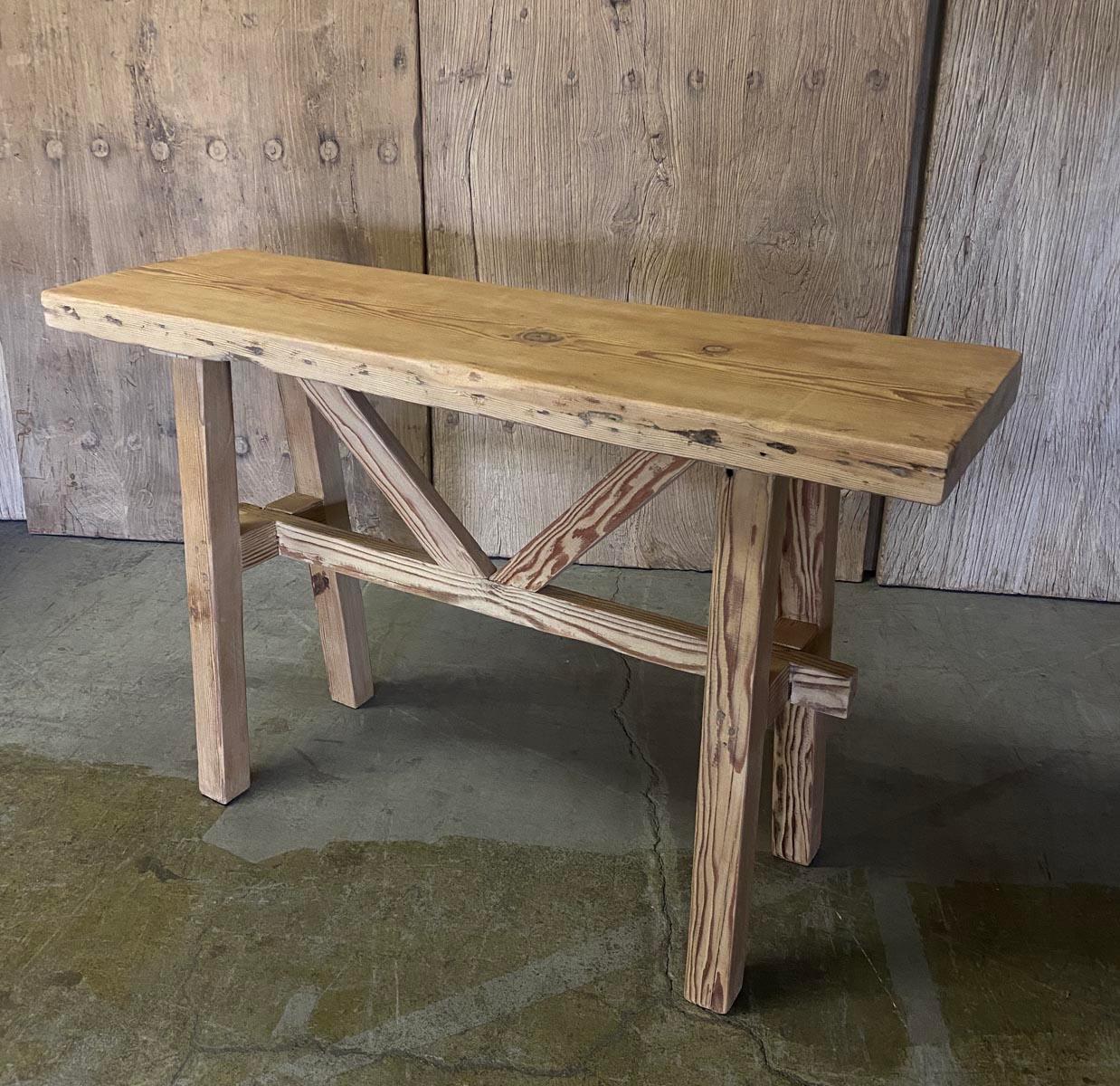 Petite console with raised V stretcher made from reclaimed Douglas fir. Reclaimed wood shows age appropriate wear, knots, nail holes and surface cracks may be visible. Sturdy, new construction. Sanded and smooth and finished in a dead flat clear