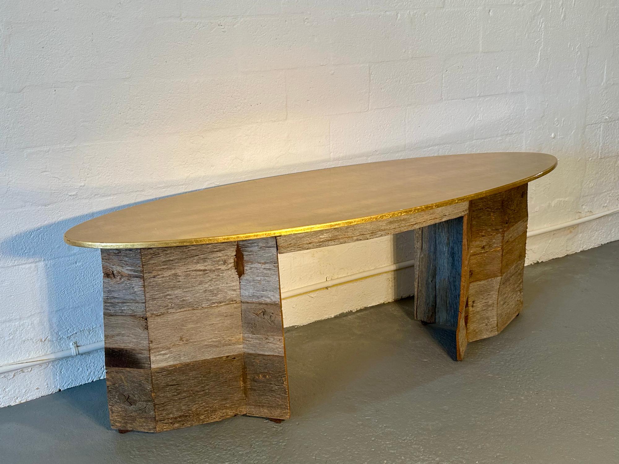 Rafael handcrafted the beautiful Golden Desk, with legs made from reclaimed barn wood and a maple top. The top features gold leaf and a non-toxic oil finish, and it includes a hidden push-open drawer.

Like all of Rafael's creations, the Golden Desk