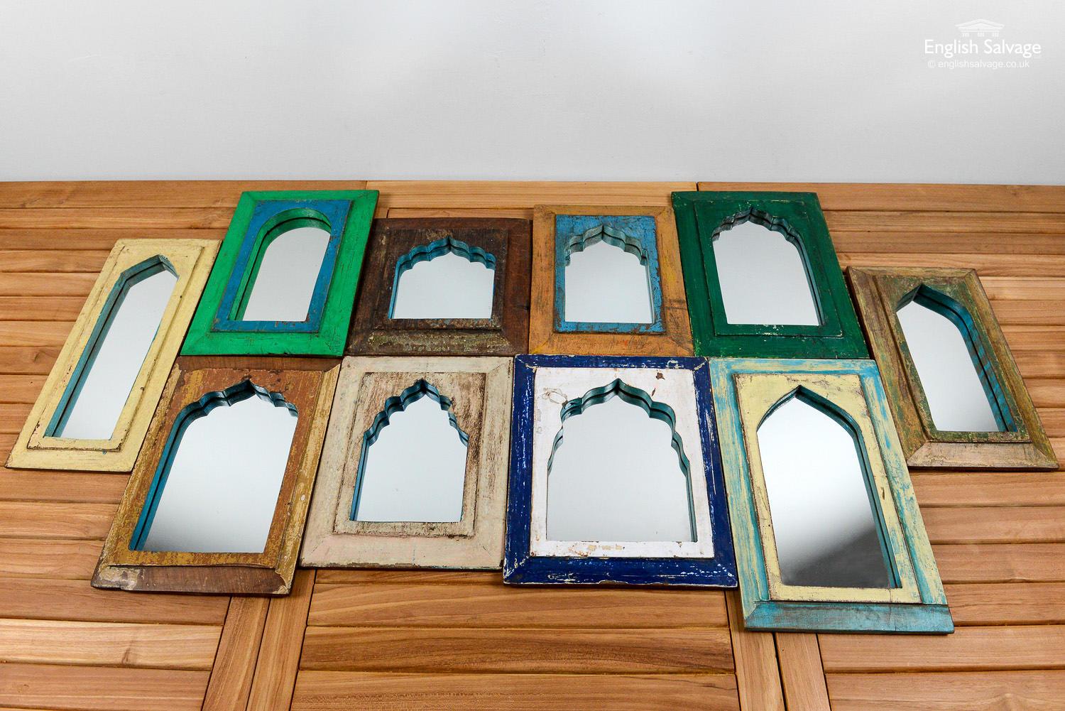 Handmade in India using salvaged wood, no two of these mirrors are the same. They have a lovely arch shape to top of the frames. The vibrant paint has come off in places, and there are surface scratches and knocks as is to be expected with re-used