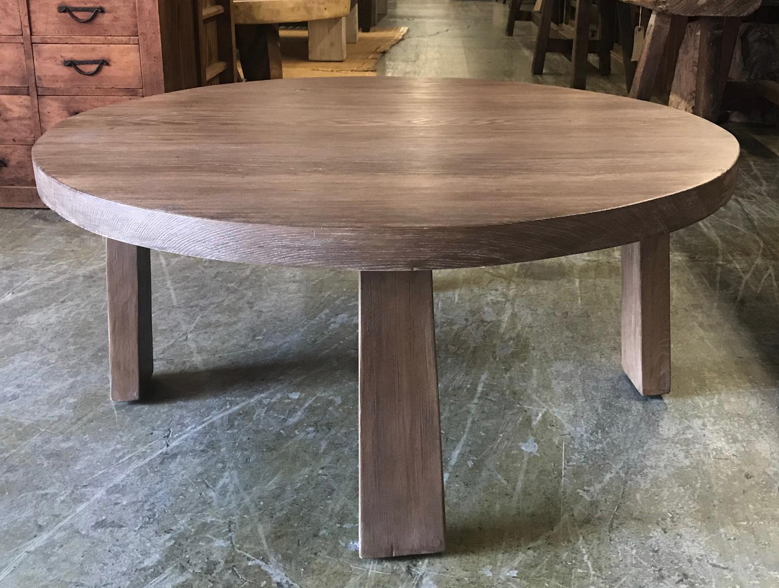 Round reclaimed Douglas Fir coffee table with four legs. Top measures 1 3/4 inches thick. As shown in dark latte. Reclaim wood always shows natural variations such as knots and grain size, and natural aging. 
Can be made in custom sizes and