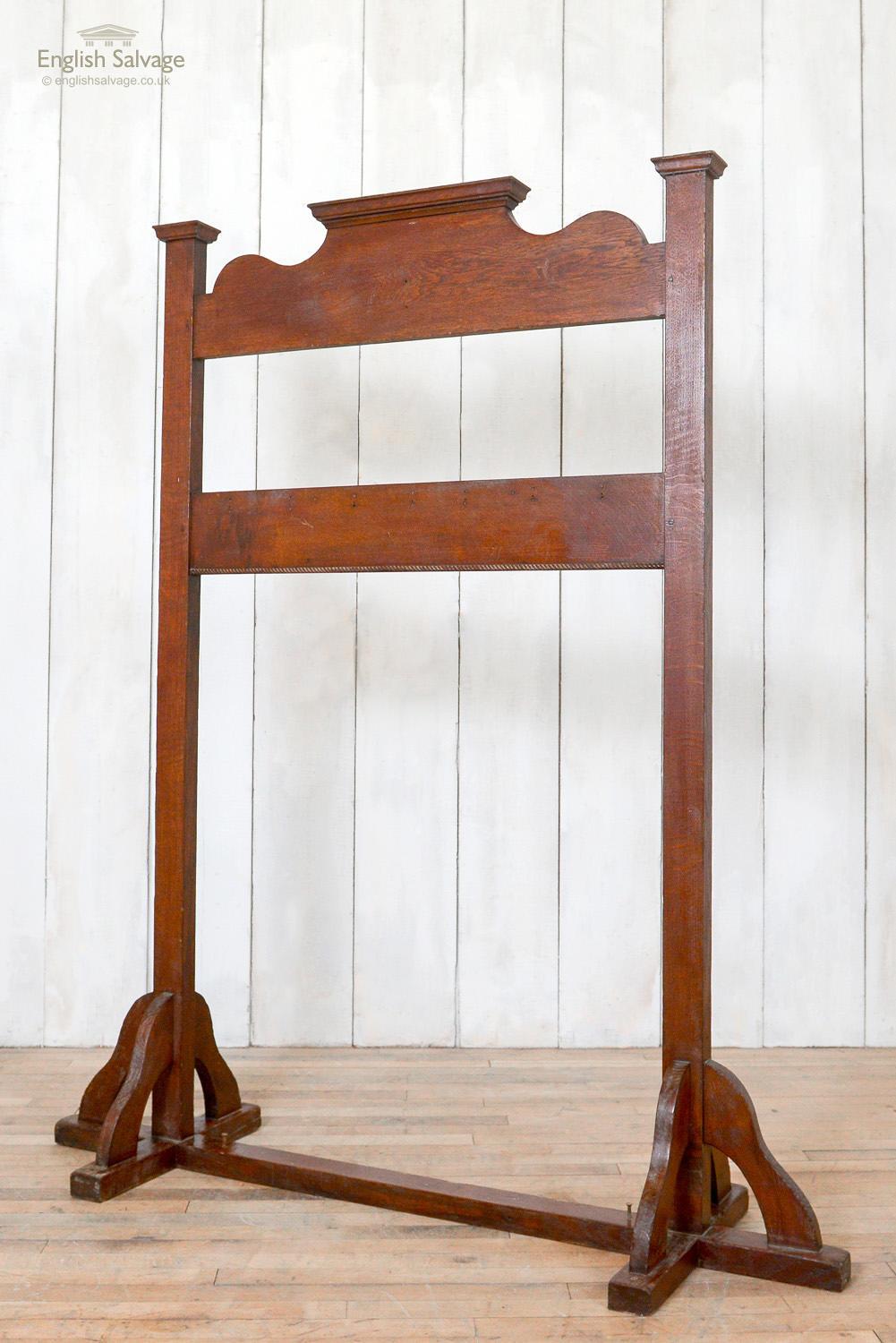 Wooden coat hook stand. Sturdy freestanding design. No hooks present.