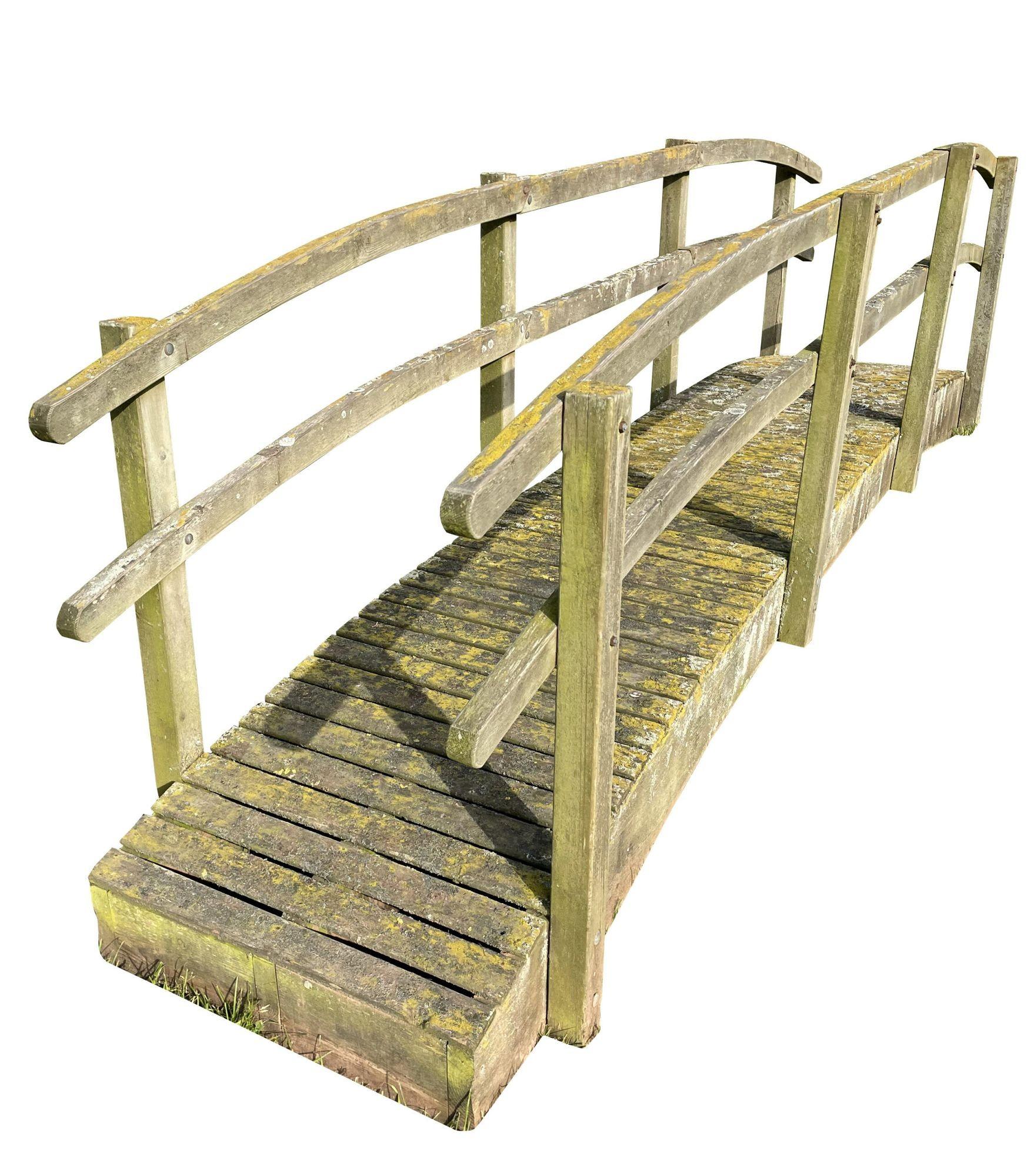 Reclaimed wooden garden footbridge. A wonderfully weathered footbridge with a great look to it. The bridge is in good condition and would make a beautiful addition to a garden.