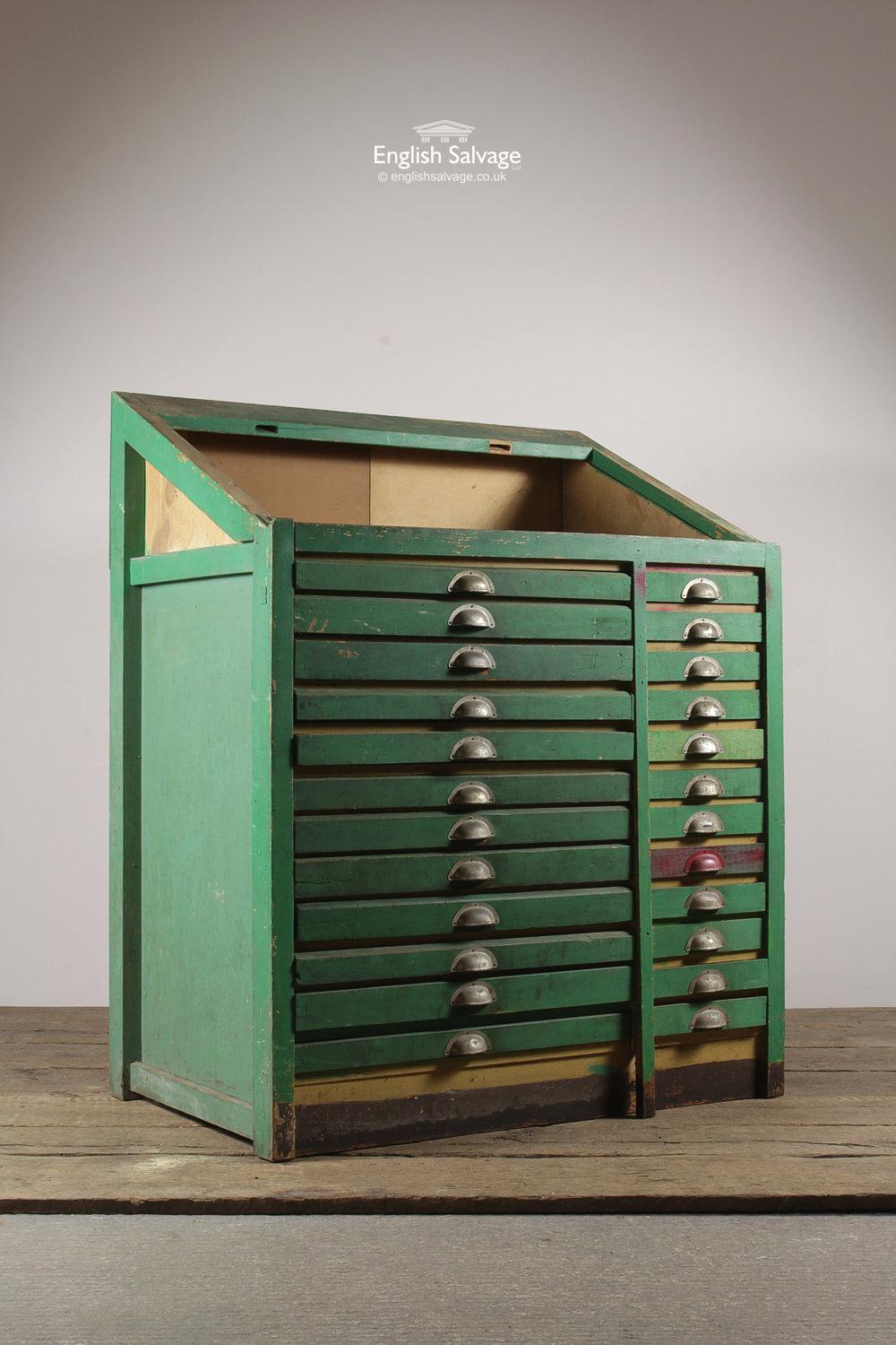 Reclaimed wooden typesetter's / printer's cabinet with a green paint finish. The cabinet features 24 shallow drawers which are sectioned inside - ideal now for craft or jewelry storage! The height listed on the main page refers to the rear of the
