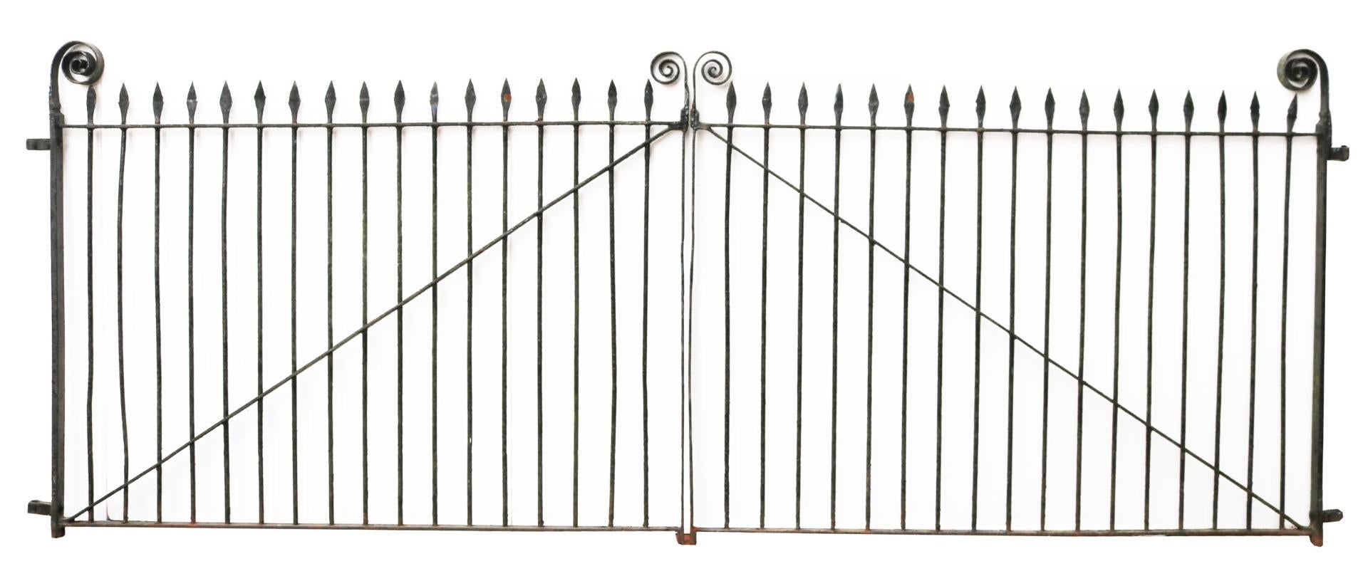 A set of very wide mid-Victorian wrought iron driveway gates with spear finials and scrolling ends.

Additional Dimensions:

For an opening of approximately 400 cm