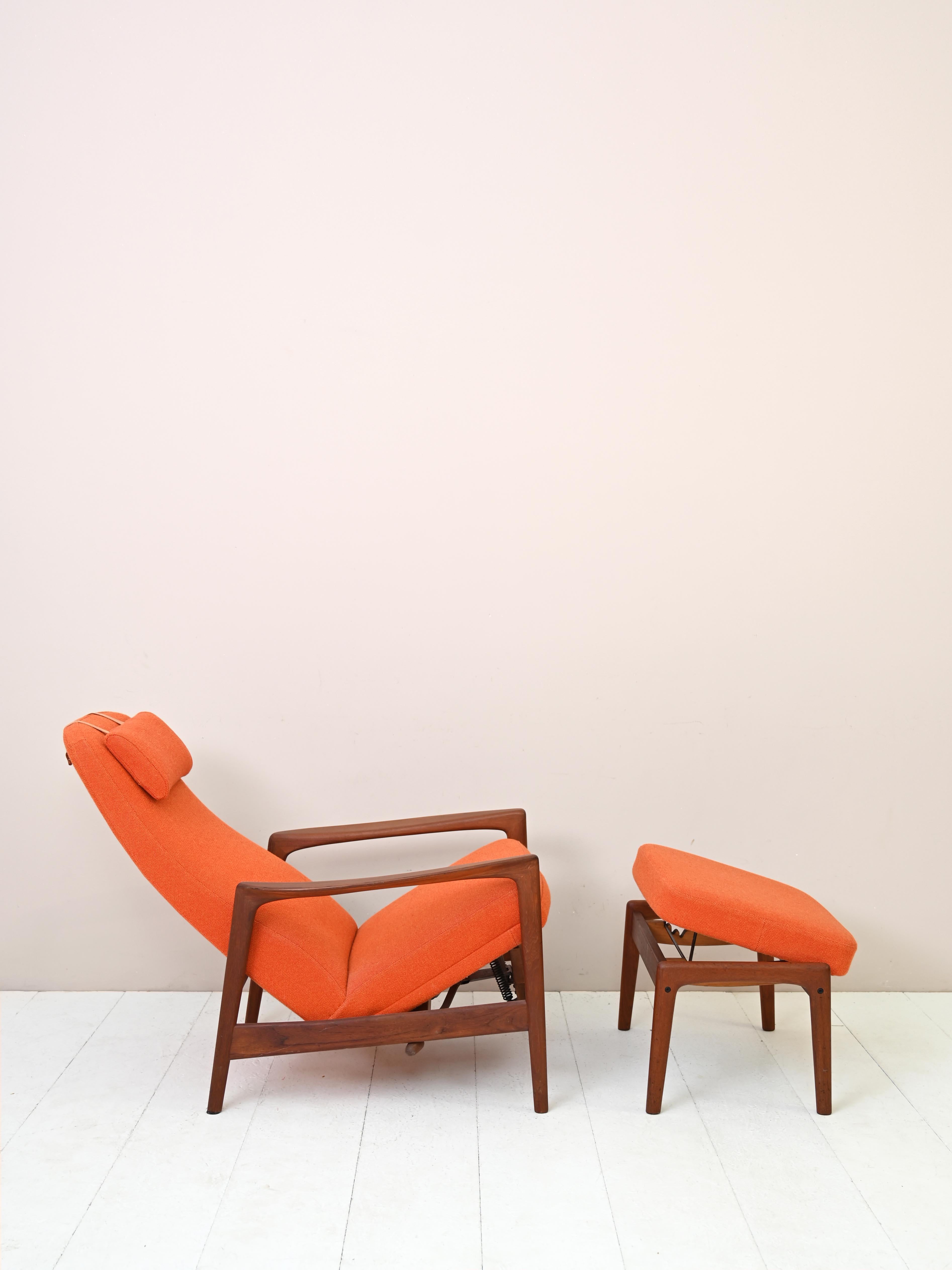 Vintage 1960s armchair with footstool.
 
Mid-century Scandinavian recliner armchair by Folke Ohlsson for DUX.
Upholstered in original orange fabric with solid teak frame.
The chair can be placed upright or reclined, and the ottoman can be