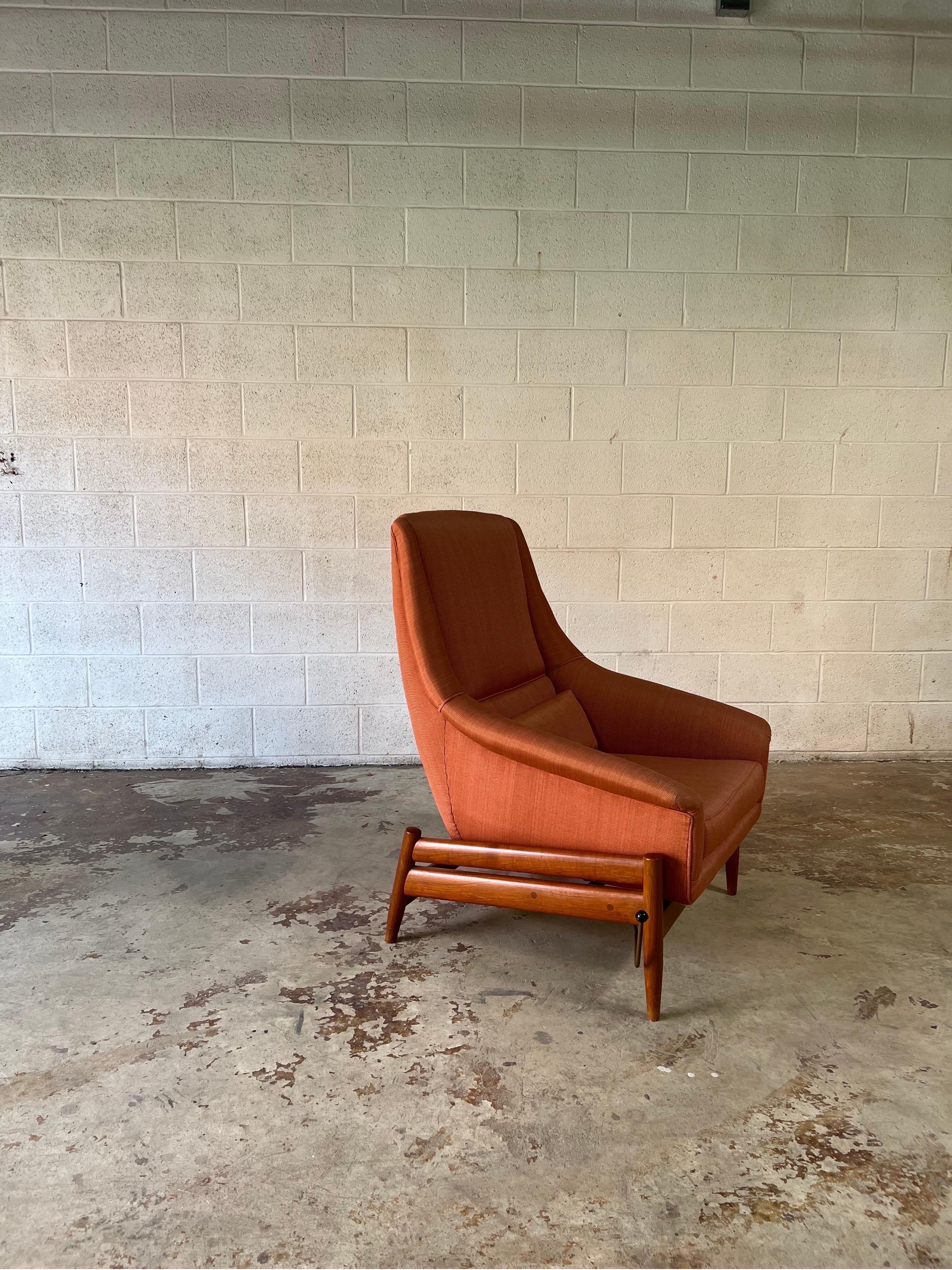 Teak rocker / recliner by L.K. Hjelle, Norway circa 1960’s This 1960s chair has three adjustable seating positions controlled by the visible side lever. The chair sits on a beautifully crafted teak frame. The upholstery is a light pink or salmon