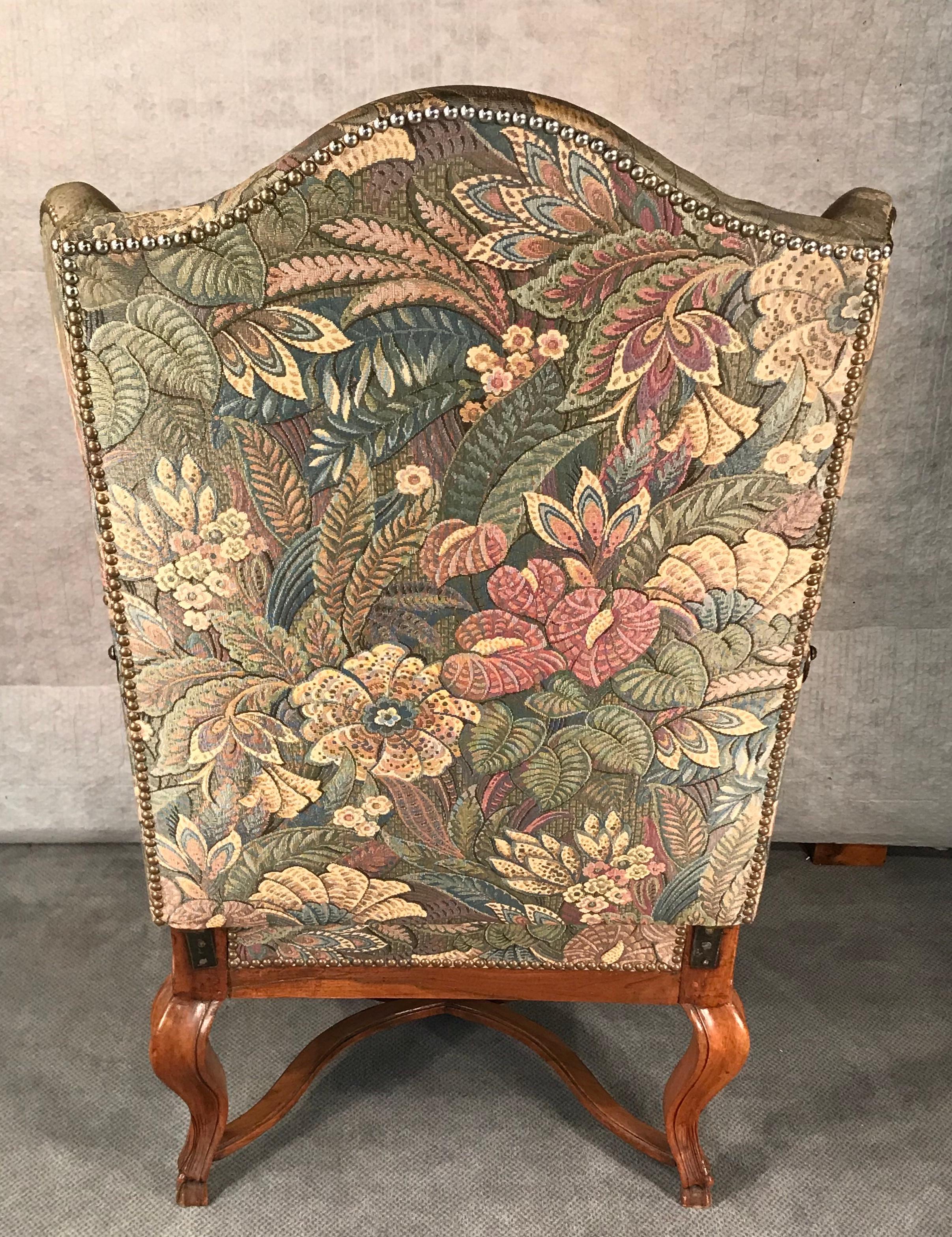 Reclining Baroque wingback chair, Southern Germany 1750-1760, walnut. This rare and interesting armchair is in original condition. The 18th century recline function is original. It has been reupholstered by a former owner. There is some fabric left