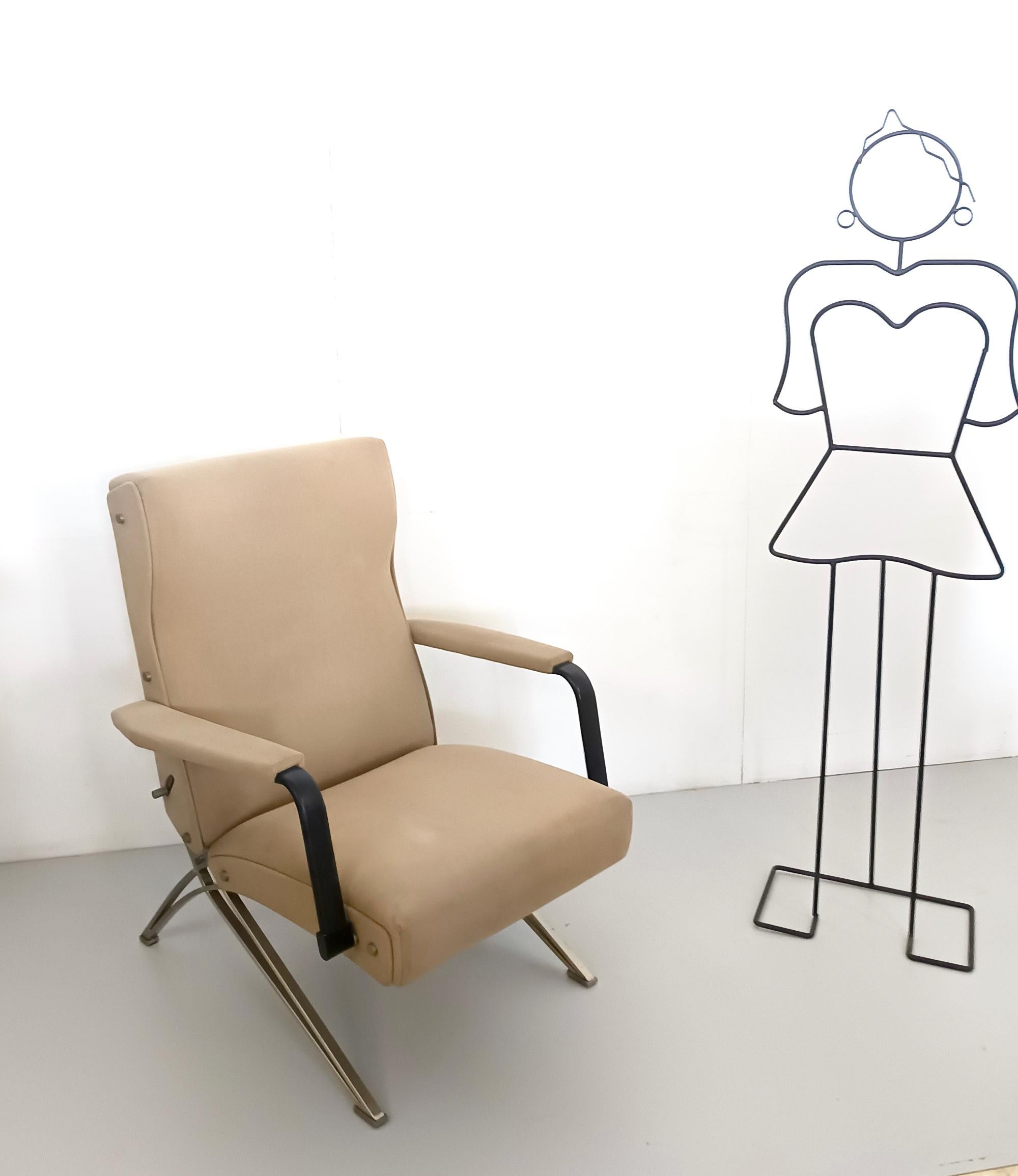 Made in Italy, 1960s. 
This chair features a metal frame and it's upholstered in beige fabric. 
It may show slight traces of use since it's vintage, but it can be considered as in good original condition and ready to become a piece in a home.
It has