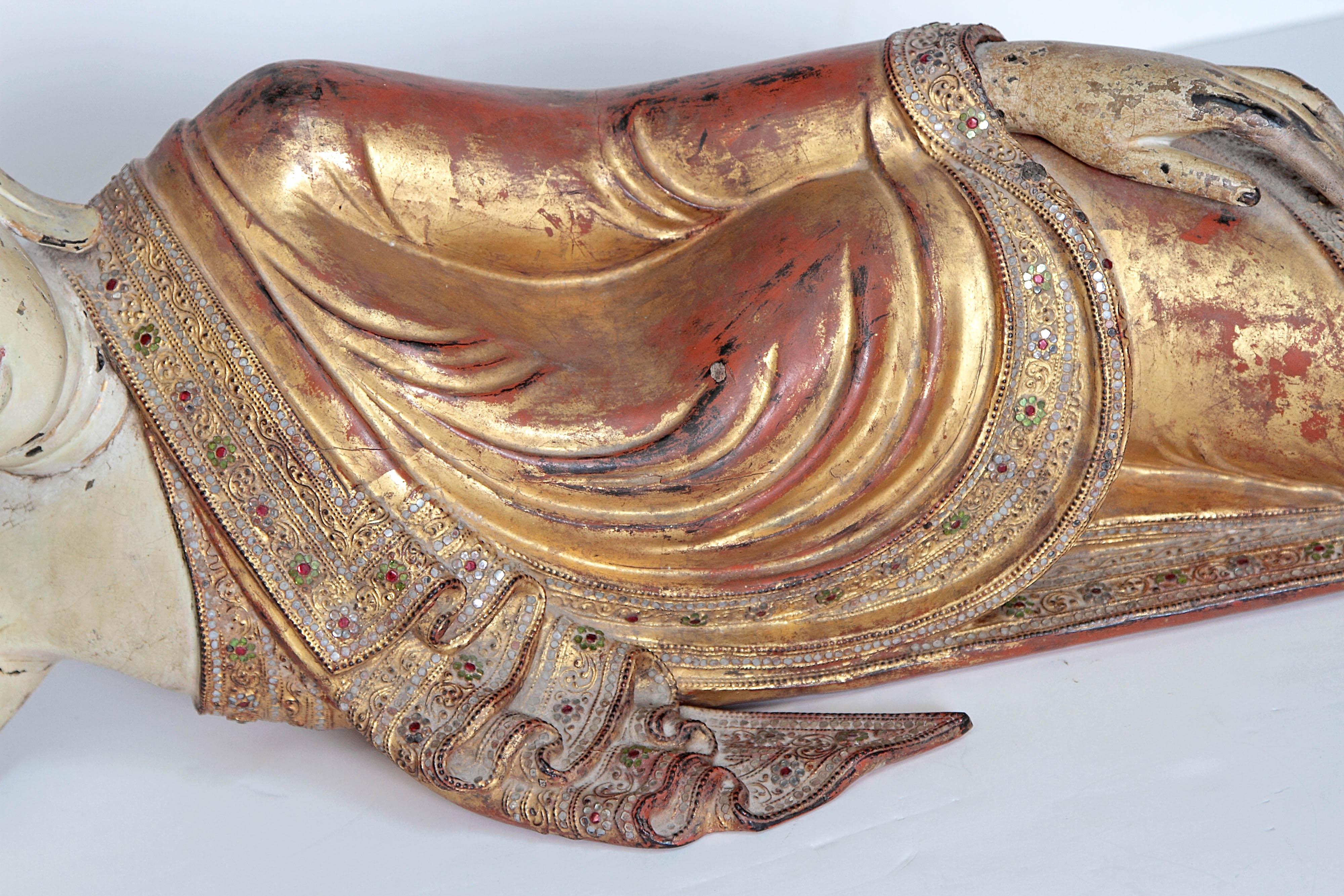 Carved Reclining Buddha or Draped in Golden Robes with a Jeweled Border and Headress