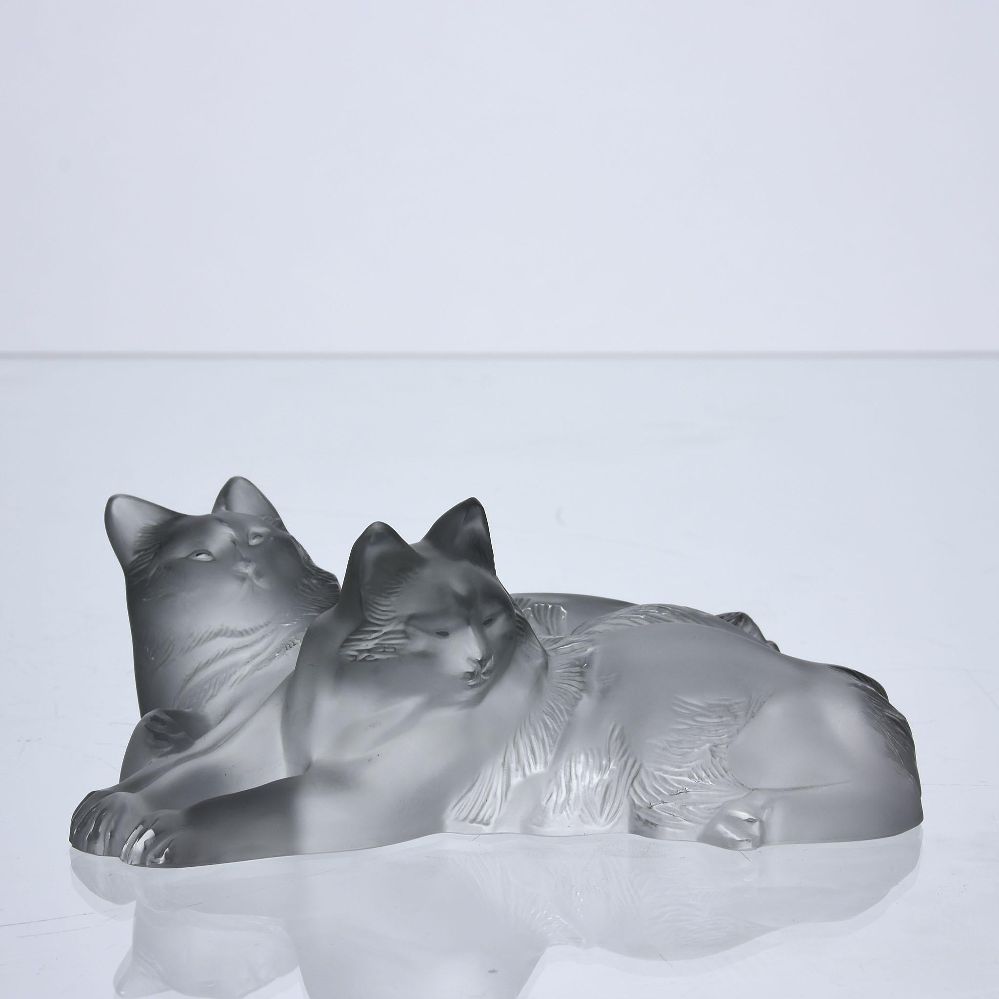A delightful frosted crystal glass group of two reclining cats resting with fine hand finished detail, signed Lalique France
Additional information

Measures: width: 16 cm

Condition: excellent condition

Circa: 1970

Materials: frosted