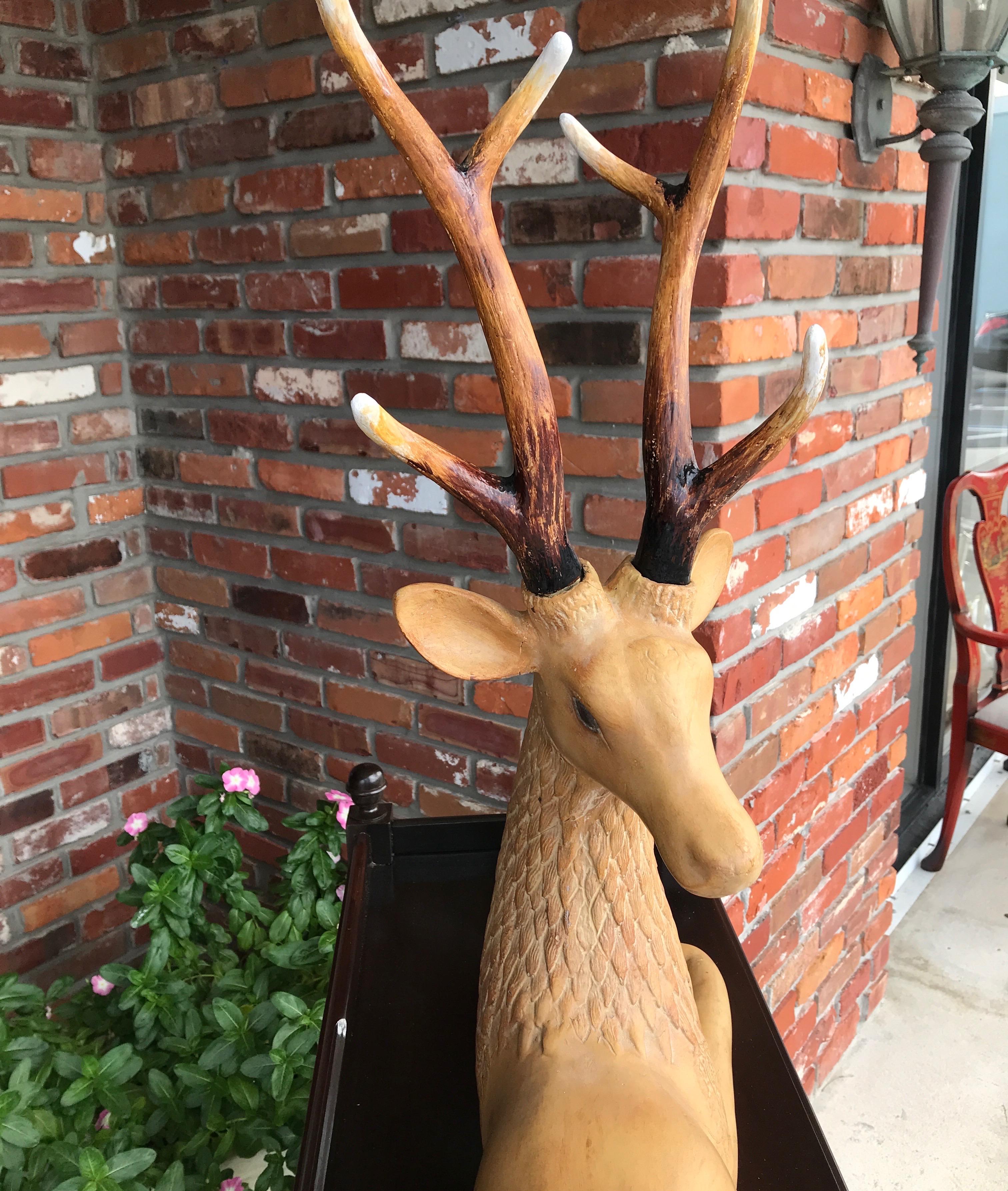 Composition Reclining Deer with Antlers For Sale