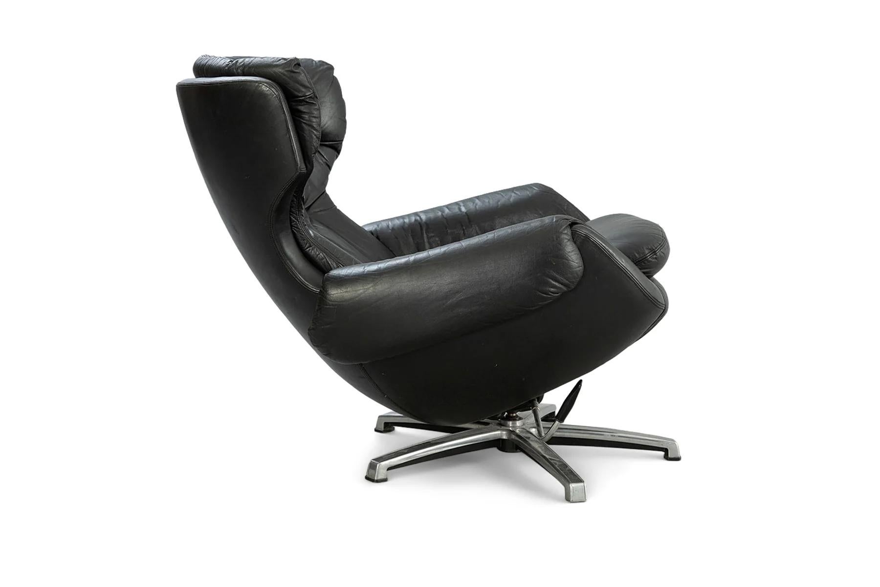 Finnish Reclining finnish lounge chair + ottoman in black leather For Sale