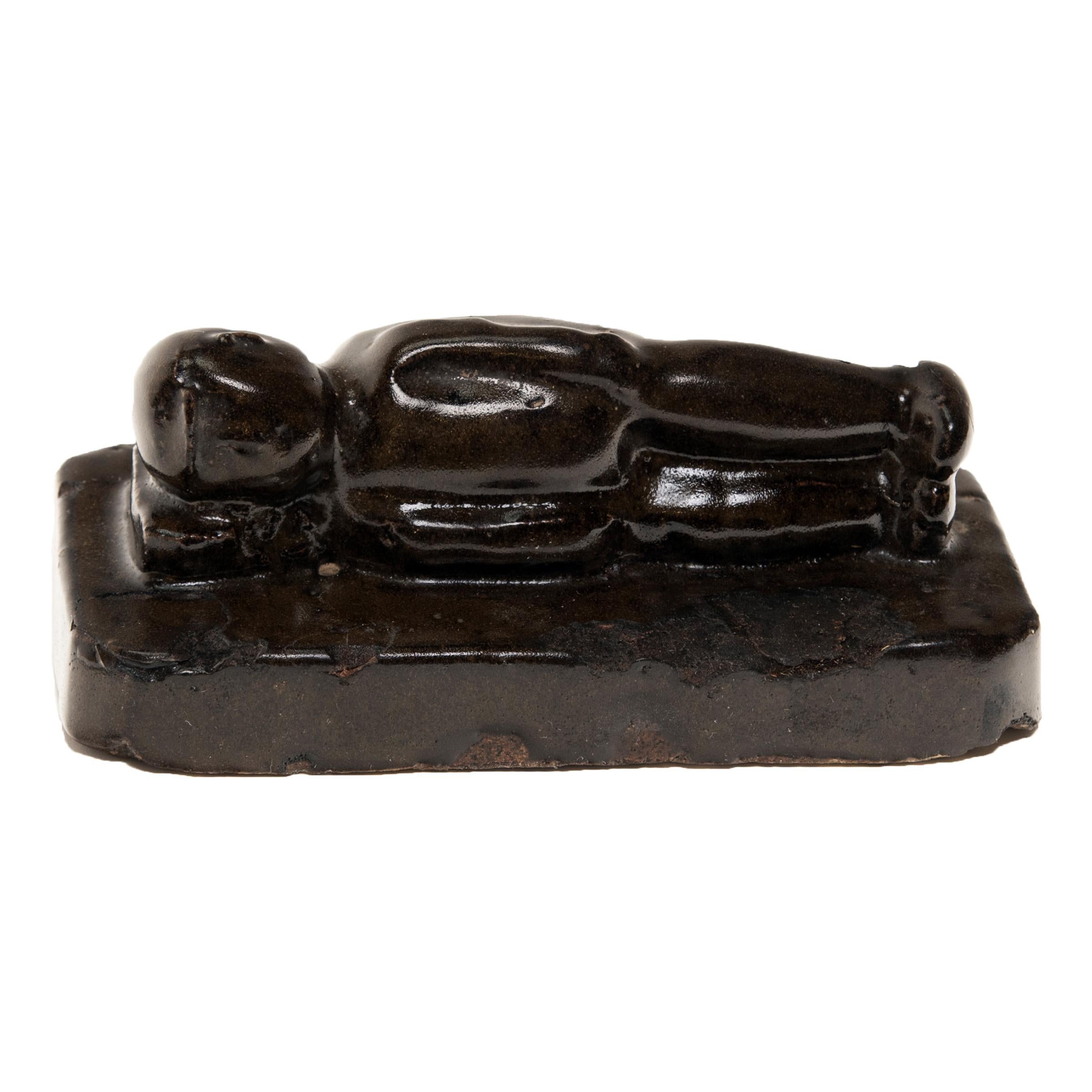 This 19th century weight originally used its heft domestically to protect a child. A simple yet ingenious concept, the stone anchored the baby’s swaddling cloth to the bed so the child wouldn’t roll out. The handle of this glazed ceramic weight is