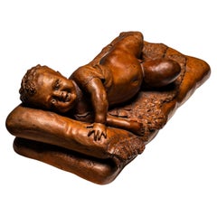 Reclining infant in terracotta, sign. F. Sans, probably Spain, Late 19th century