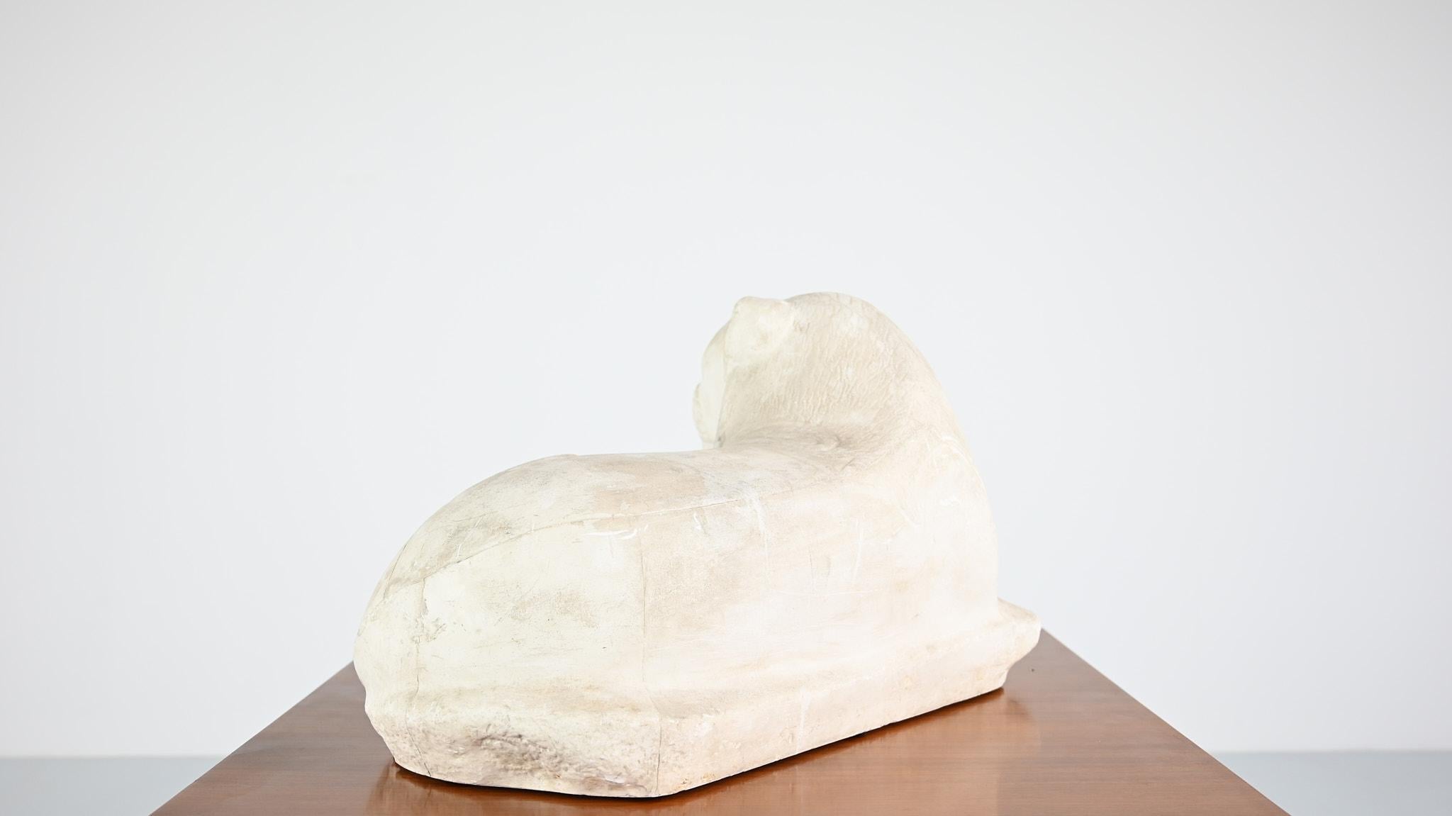 Late 20th Century Reclining lion, vintage reproduction in plaster. France, C.1970