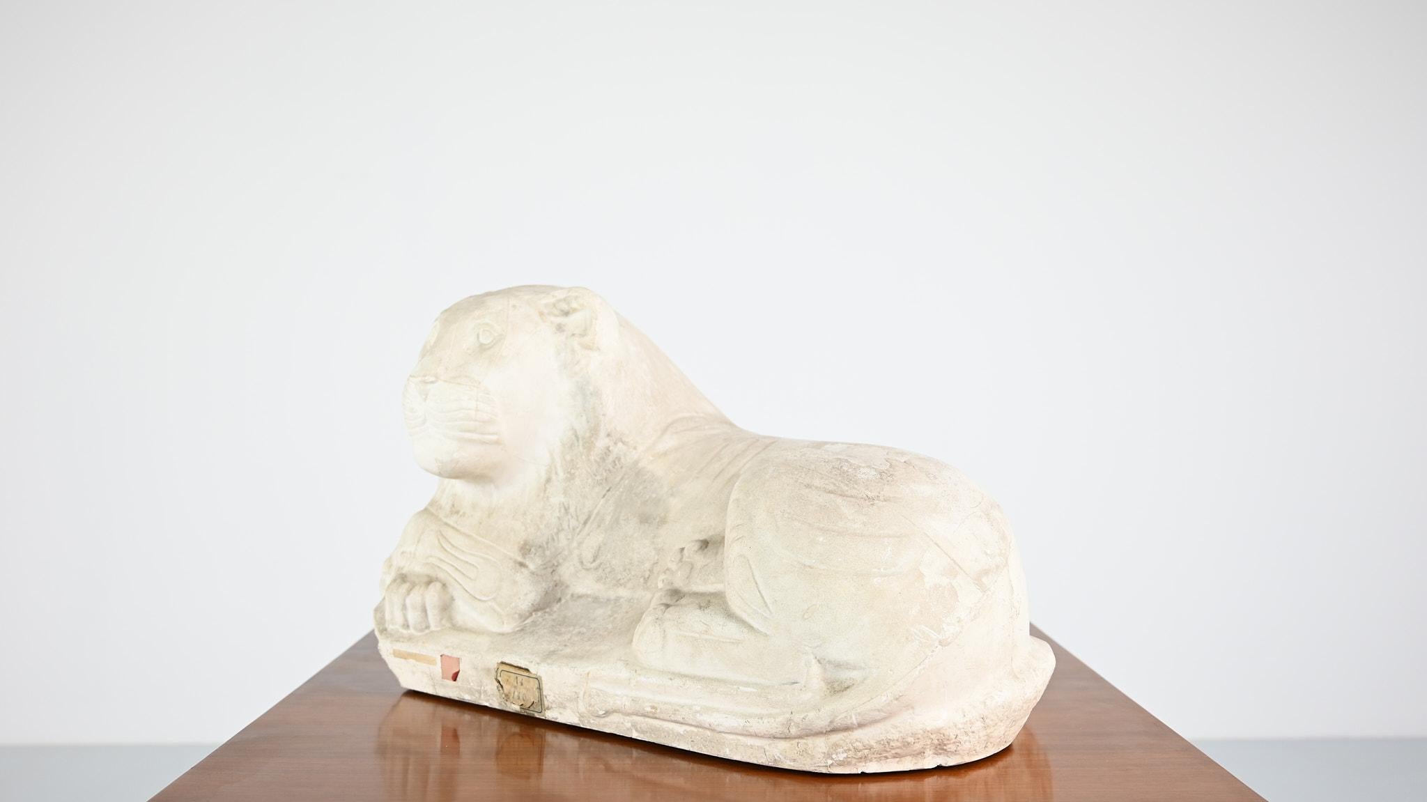 Reclining lion, vintage reproduction in plaster. France, C.1970 1