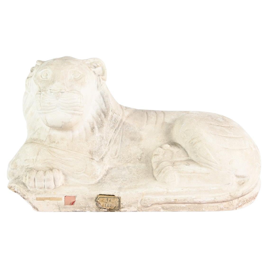 Reclining lion, vintage reproduction in plaster. France, C.1970