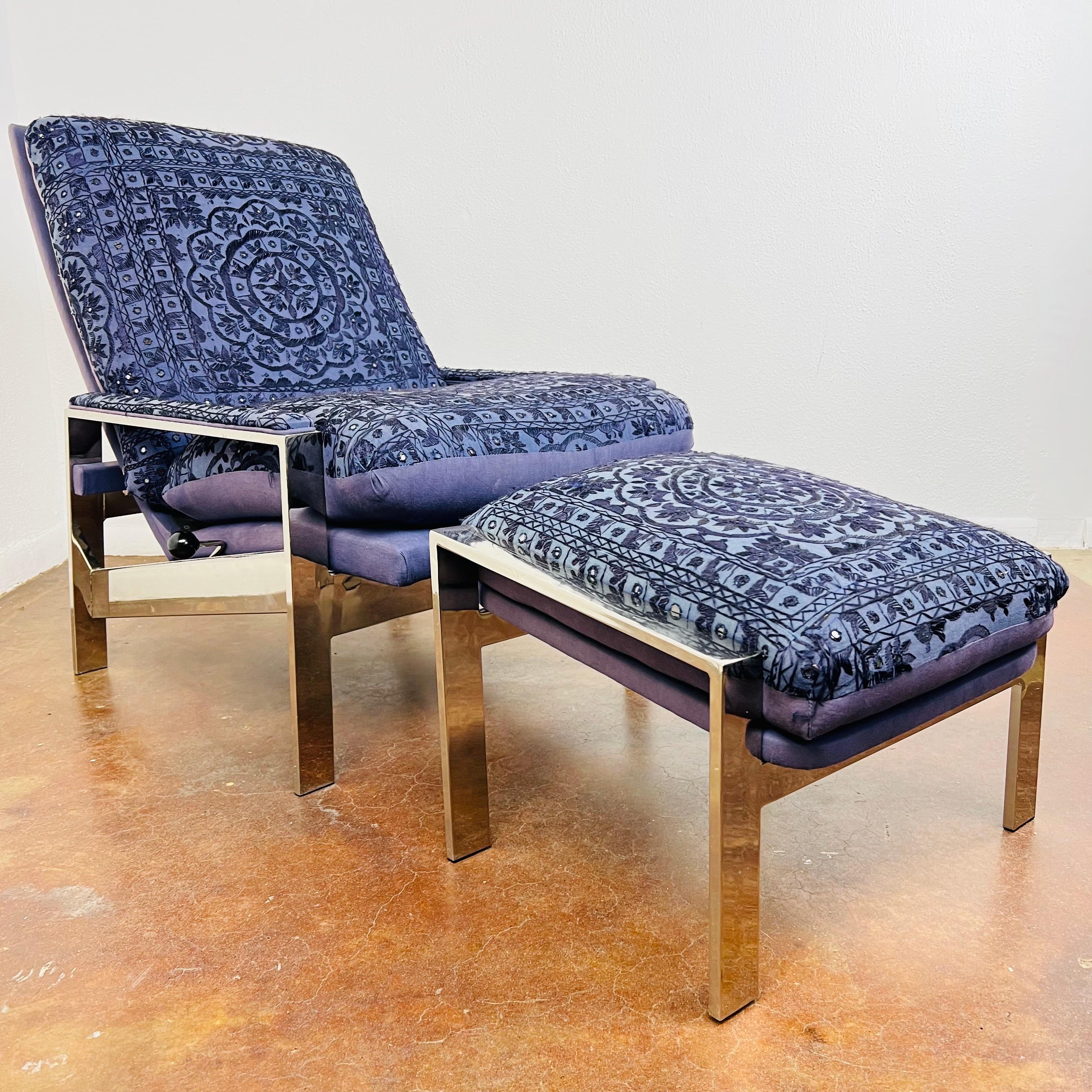 Chrome frame reclining lounge chair with ottoman by Design Environment High Point, North Carolina. Inspired by Milo Baughman for Thayer Coggin. Shisha work upholstery in good condition with some signs of wear and fading on back. 
Ottoman measures