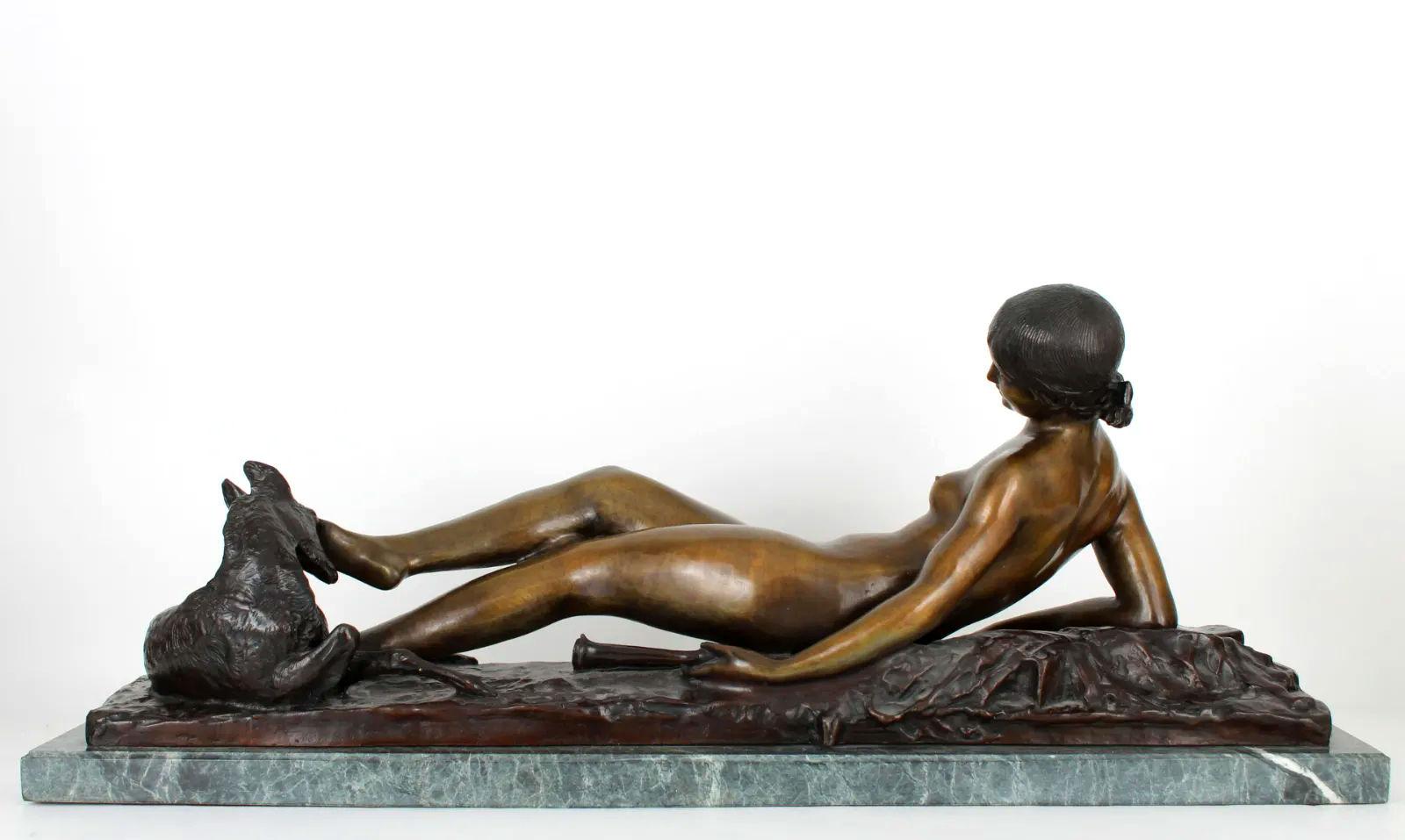 Reclining female nude bronze with baby deer at her feet, mounted on variegated green marble base by Ary Bitter (1883-1973).