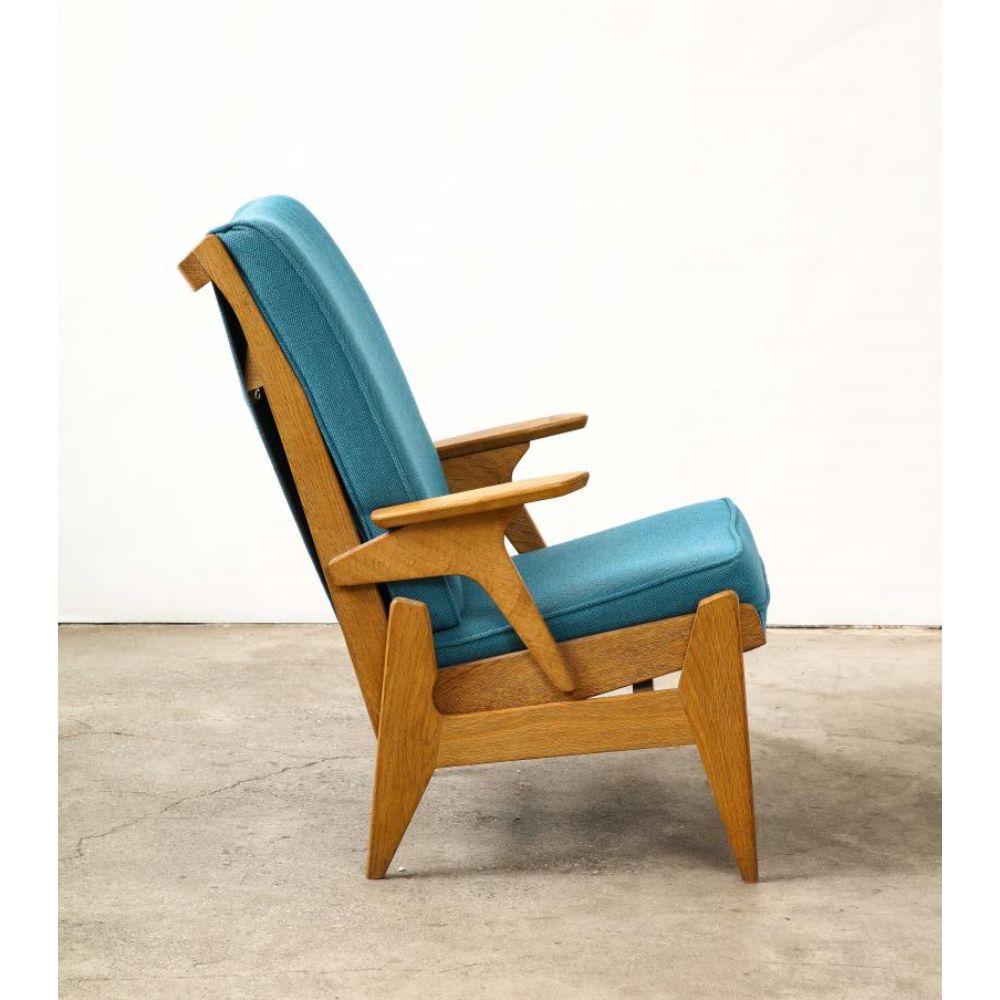 Reclining Oak Armchair/Lounge Chair by Guillerme et Chambron, France, c. 1950

Cool reclining oak lounge chair by Guillerme et Chambron. The angular lines of the chair work together beautifully, concealing the reclining mechanism. The blue