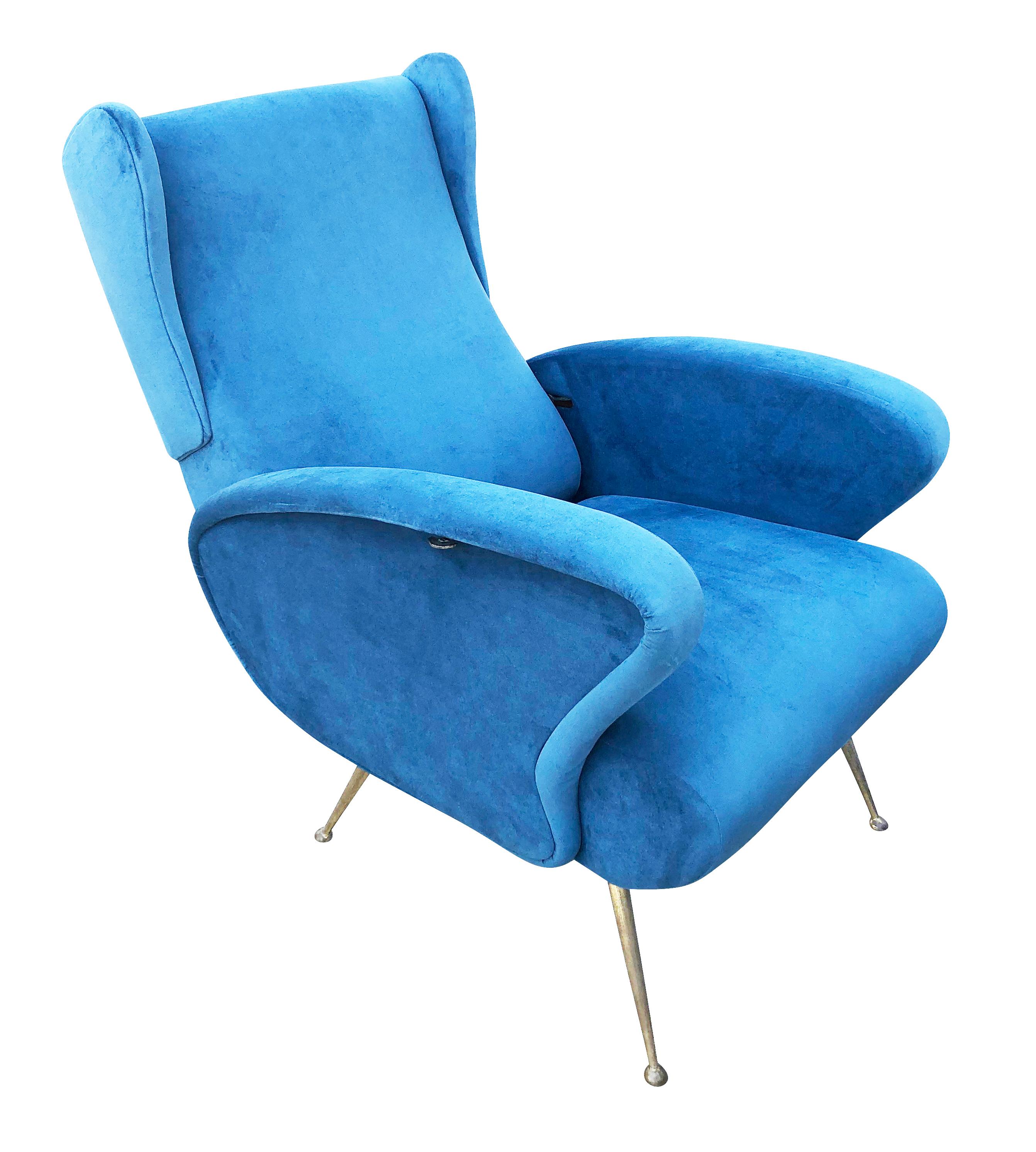 Reclining midcentury wing chair reminiscent of the works of Marco Zanuso. Brass legs and recovered in a blue velvet.

Condition: Minor wear consistent with age and use. Recently recovered.

Measures: Width 25.75”

Depth 28”

Height