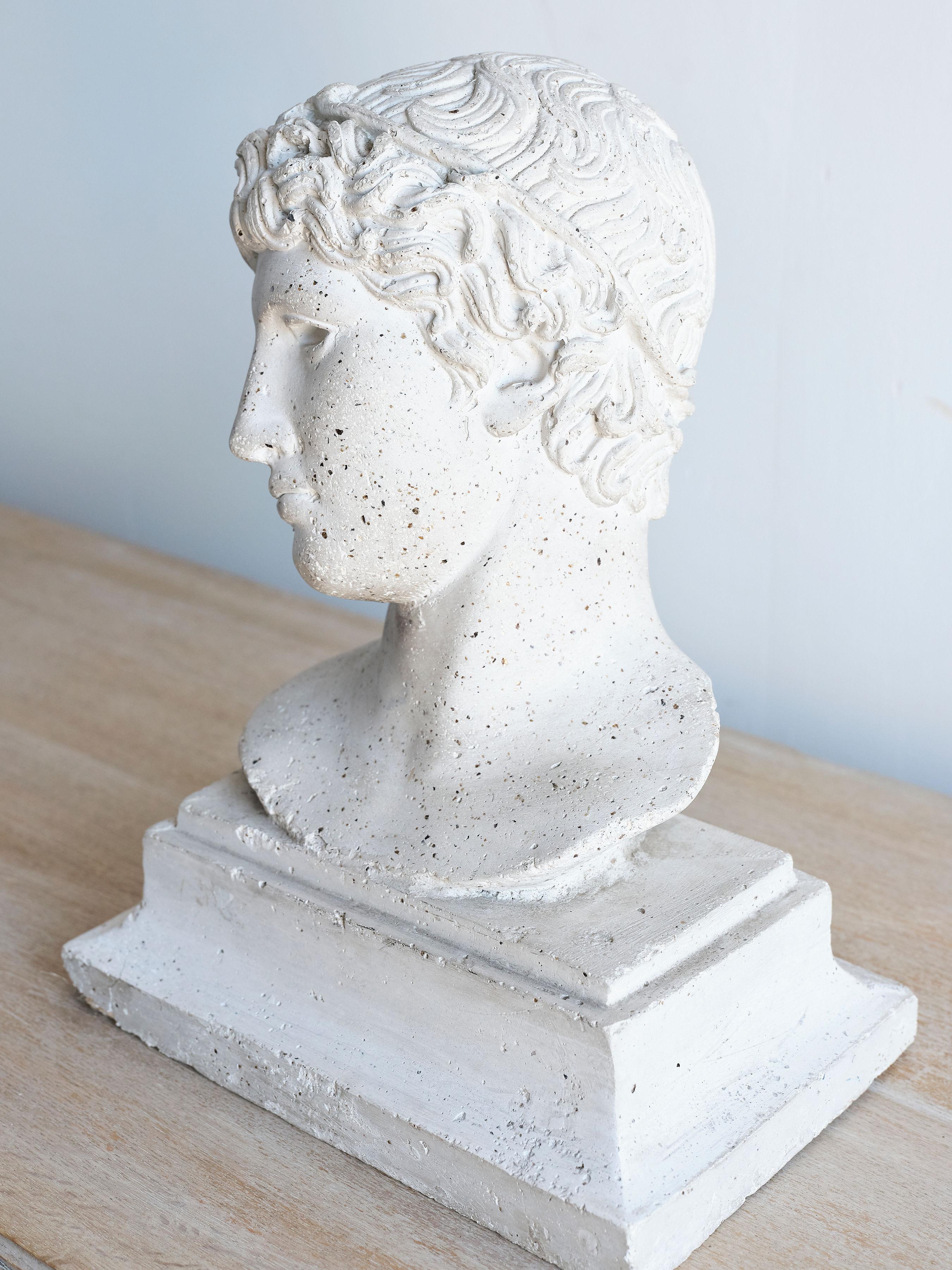 This reconstituted stone bust originates from 20th century France.