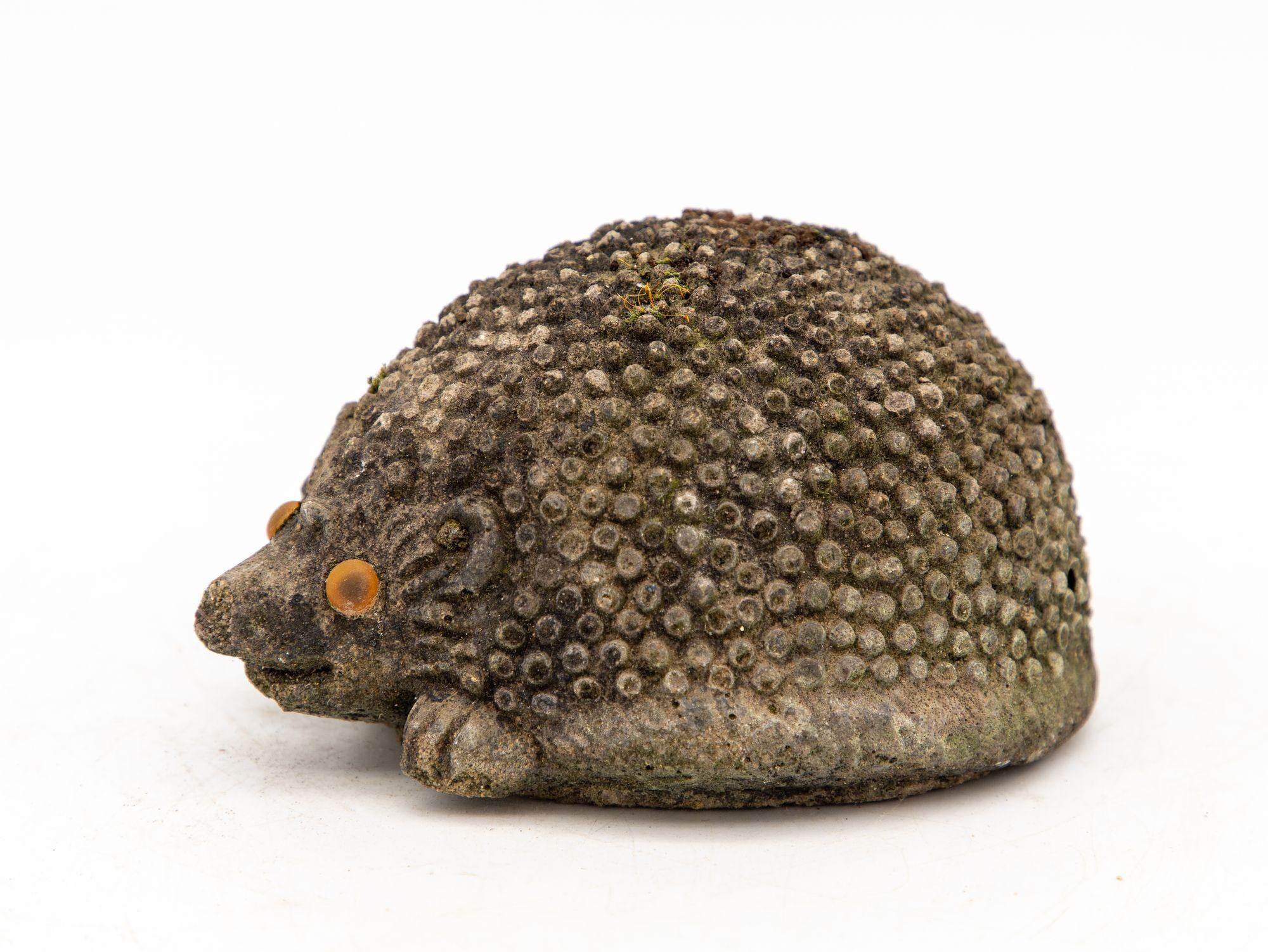 This delightful reconstituted stone hedgehog garden ornament adds a touch of whimsy and charm to your outdoor decor. This ornament is crafted with intricate details and lifelike expressions, making it a unique and eye-catching addition to any