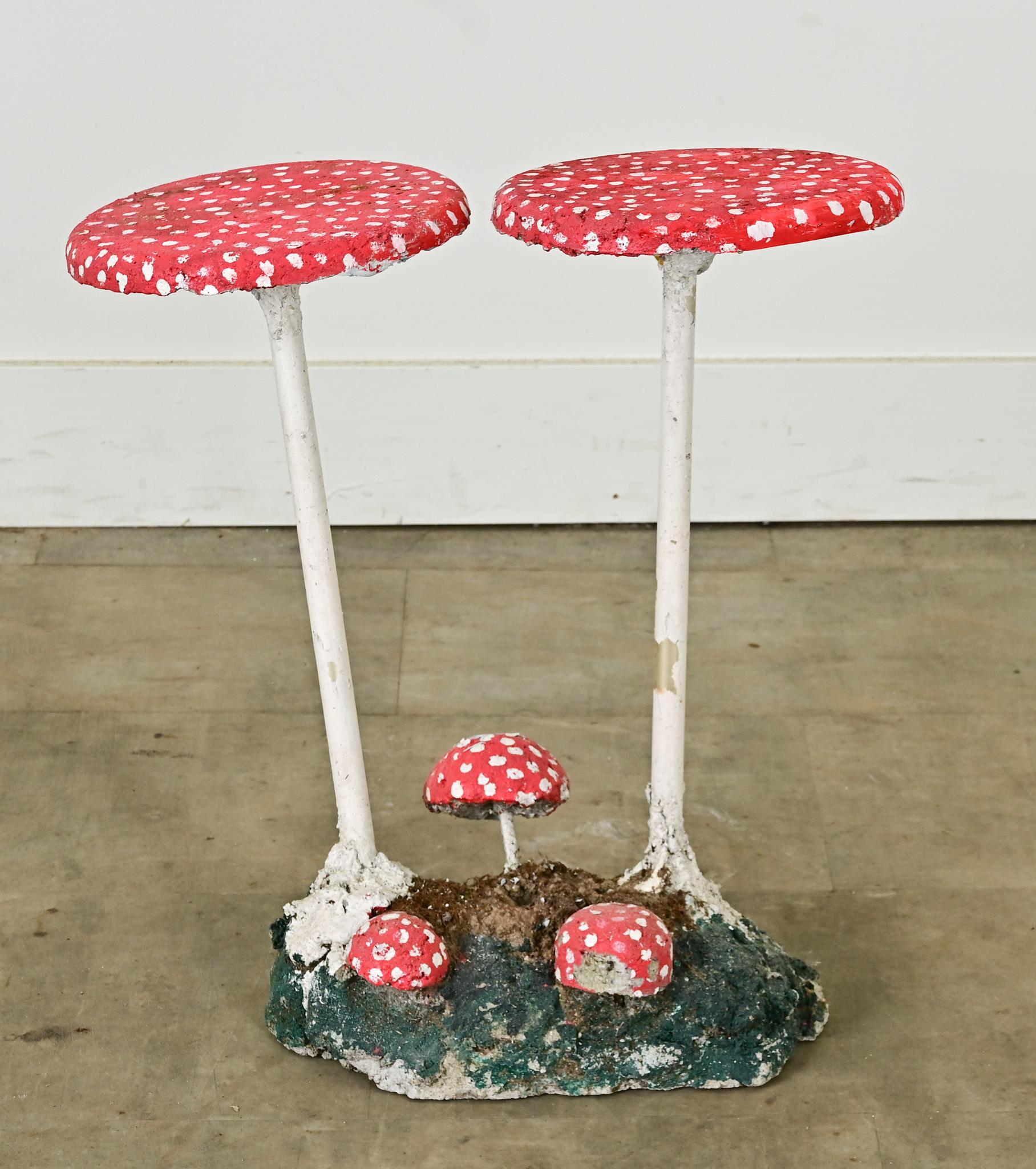 Cultivate a patch of humor in your garden with this whimsical, vintage toadstool sculpture made in England. Handcrafted in reconstituted stone and metal pipe with hand-painted finish. The flat “caps” of the taller mushrooms, 9 ¼” diameter, might