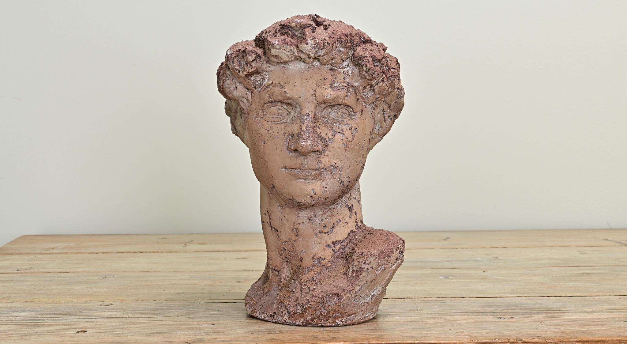 A European bust of a man made of stained reconstituted stone. Impressive craftsmanship and details are found throughout. Be sure to view the detailed images to see every angle. 