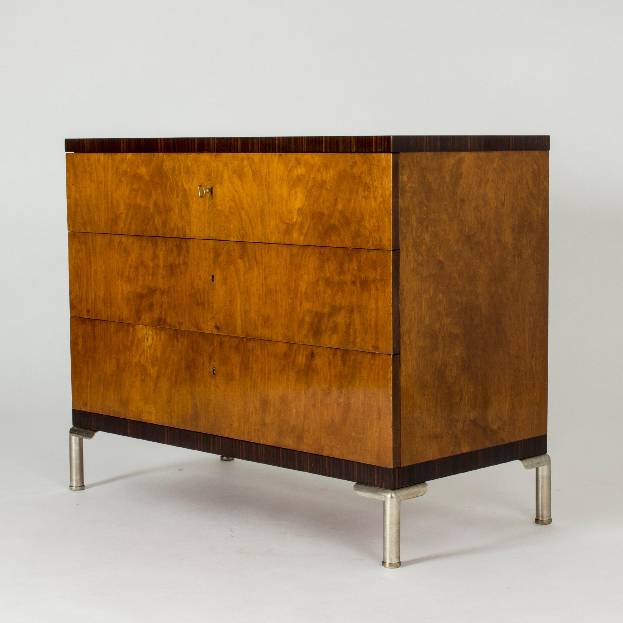 “Record” chest of drawers by Axel Einar Hjort, made from birch and ebony, with steel legs. Designed in 1932, it is strikingly modern with its clean lines and mix of materials.