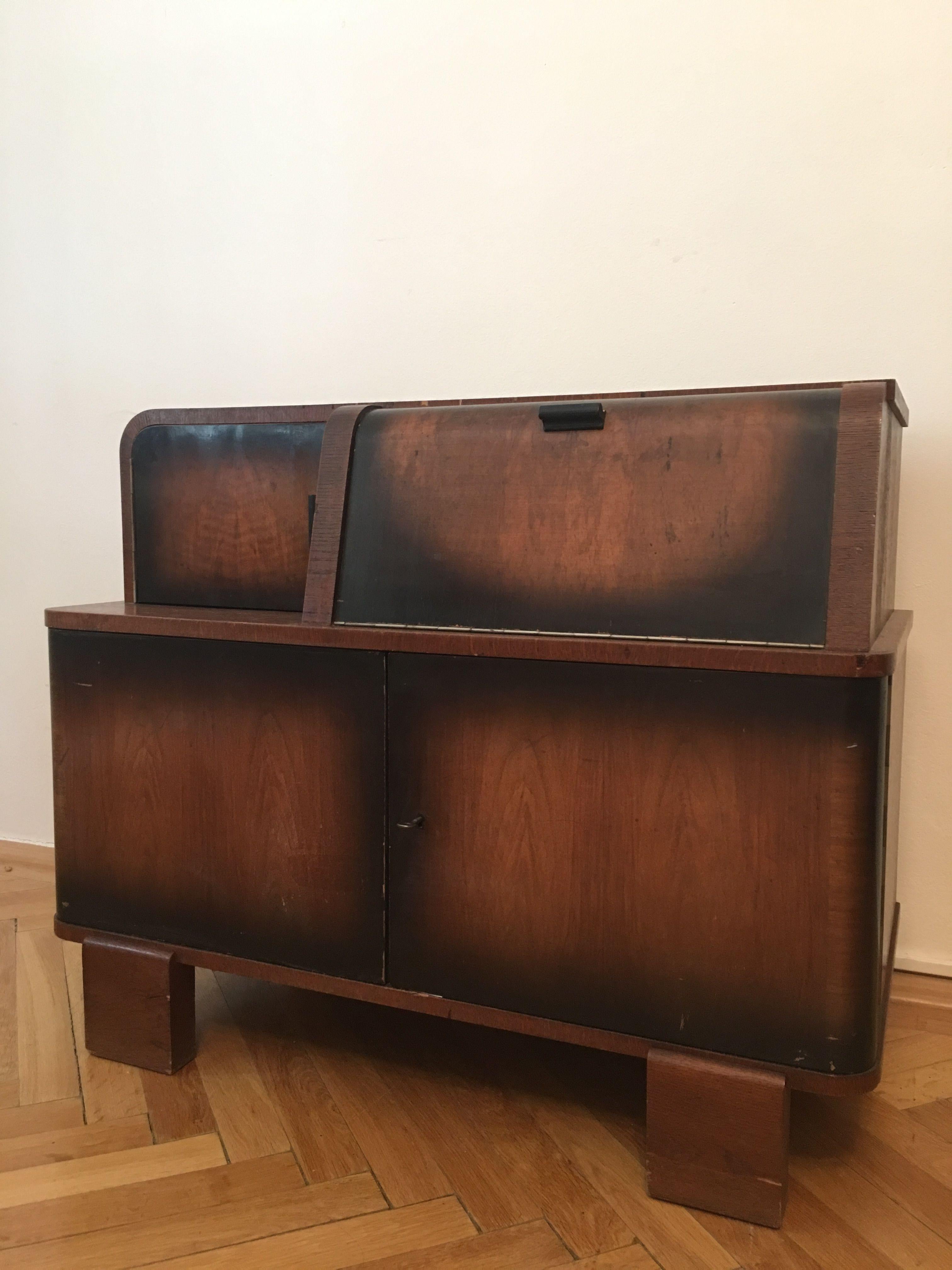 This music cabinet was designed by Jindrich Halabala in the 1930s, but due to its popularity stayed in production until 1960s. The cabinet was designed to house a record player and its records.
Measures: H 74cm x W 92 cm x D 49 cm.