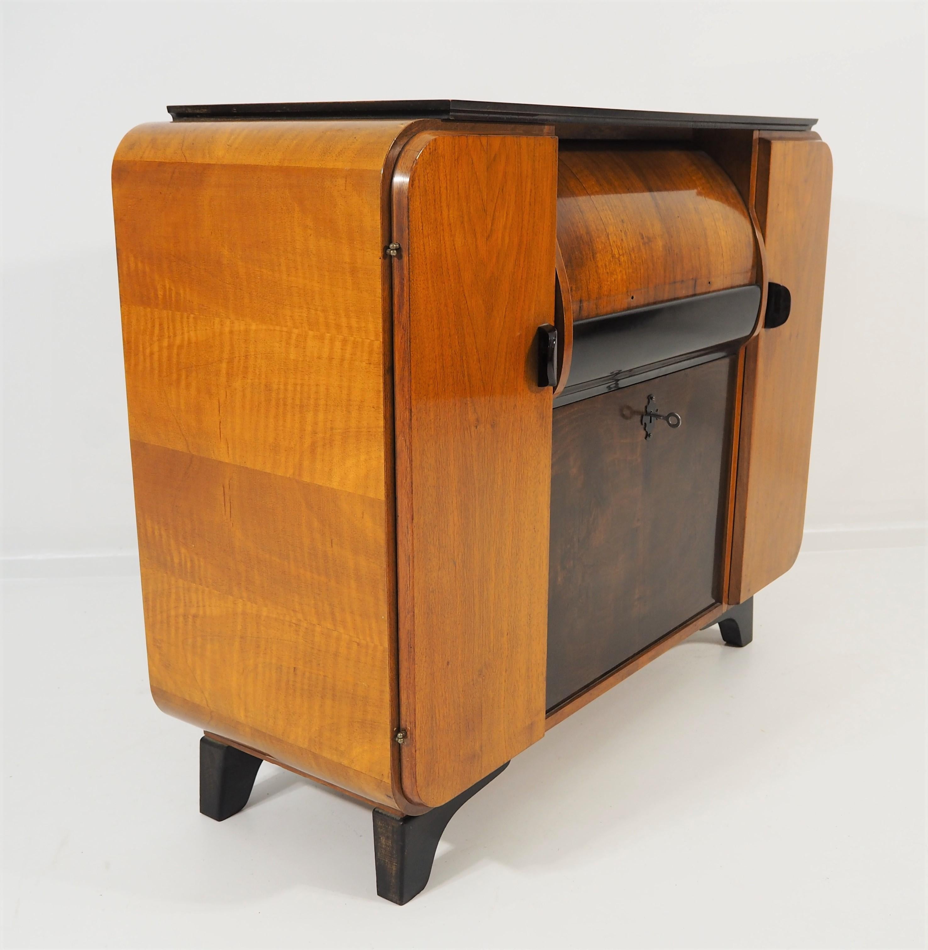 Rarity record player from Supraphon, 1959. Original condition. This piece of furniture and the disc player is in original condition. It resembles the designs of the Czech designer Jindrich Halabala.
