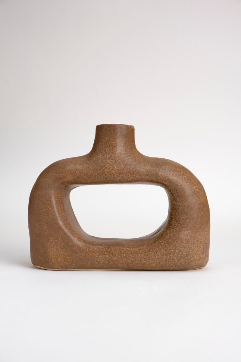Ceramic Sculptural vase from the permanent collection.
 
Dimensions: 23 x 8 x 19.