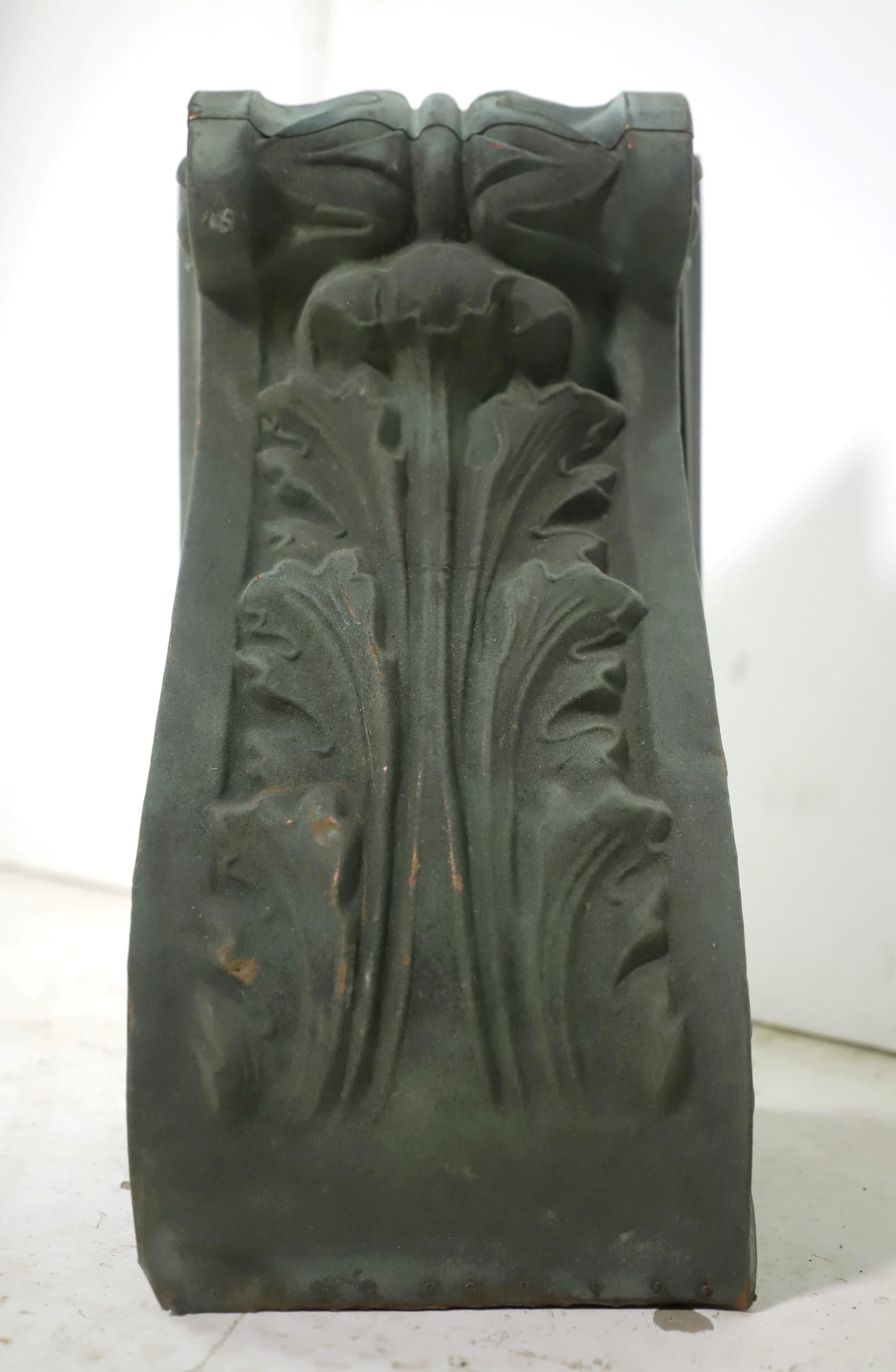 Small recovered original verdigris patina copper corbel with ornate designs. We installed a wood backing for ease in wall mounting. This is in good condition. Please note, this item is located in our Scranton, PA location.