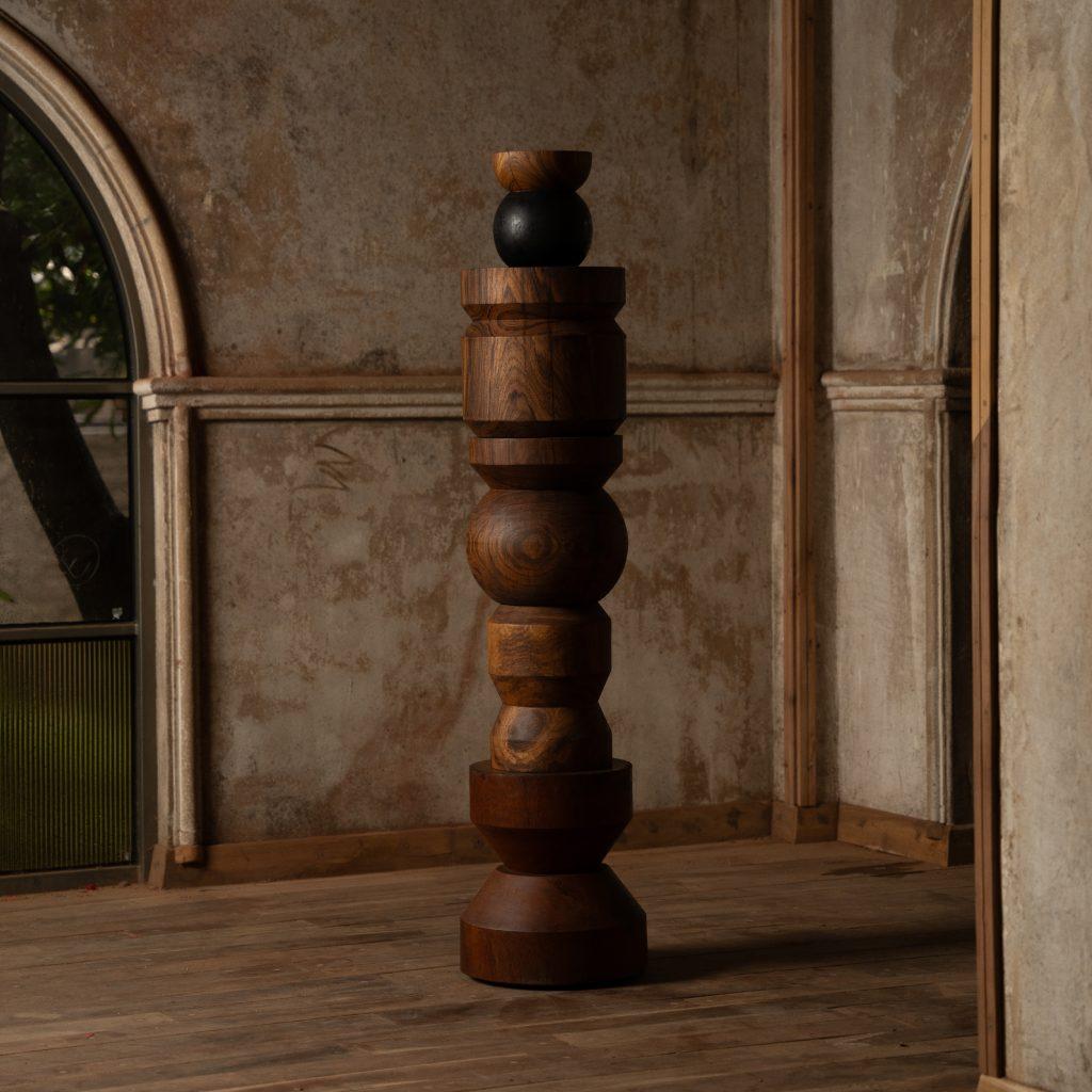 Recreational Verb Floor Sculpture by WANAS
Dimensions: D 92 x W 92 x H 194 cm.
Materials: Metal, teak wood, and wood. 

The size and finish are customisable on request. Please contact us.

Stack them, then un-stack them, move them, or co-exist