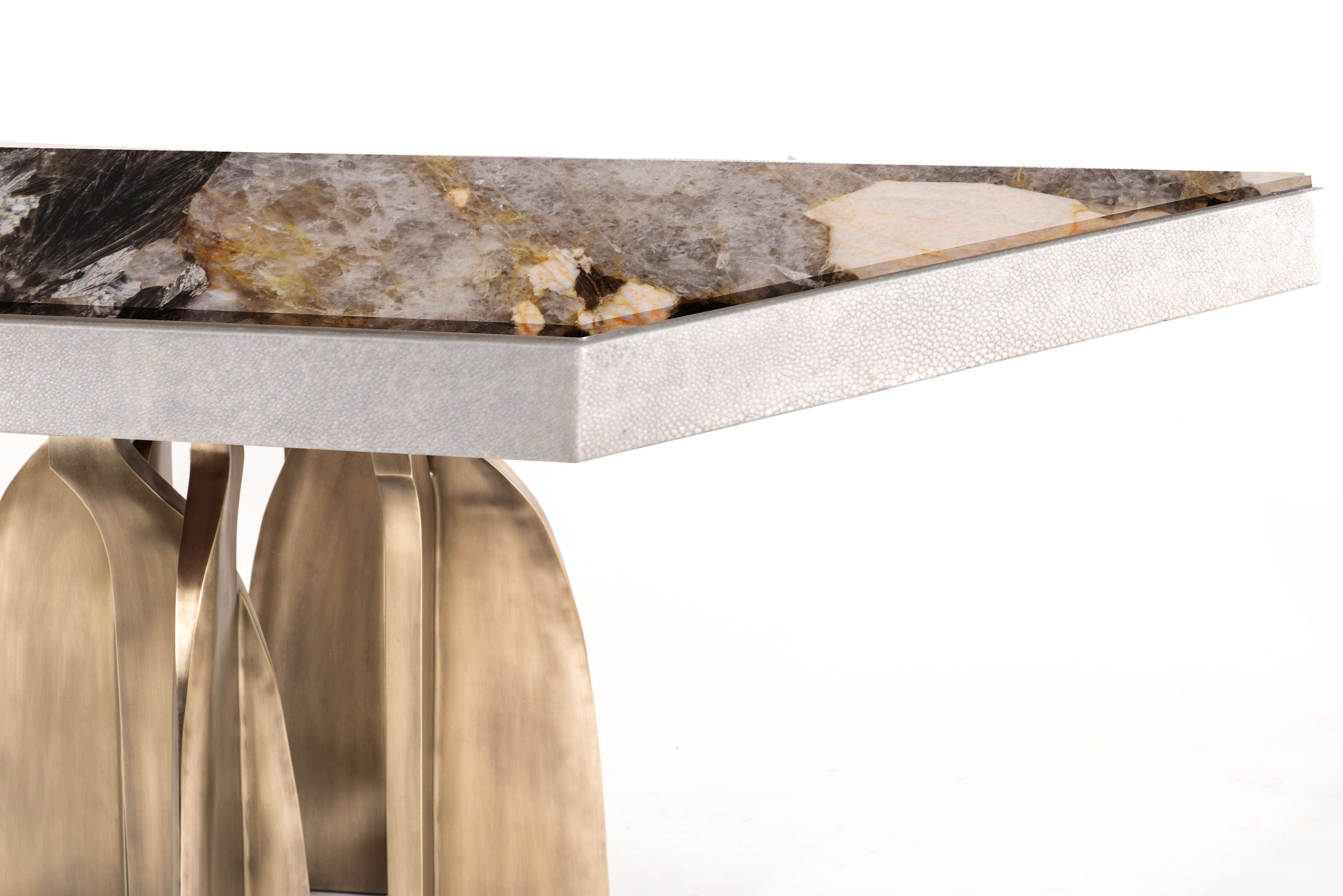 The Chital breakfast table is a stunning piece, a statement in any space. The rectangle Patagonia stone inlaid top is stunning and one of a kind. The semi-precious stone has beautiful color tonalities and silver inserts. The side border of the top