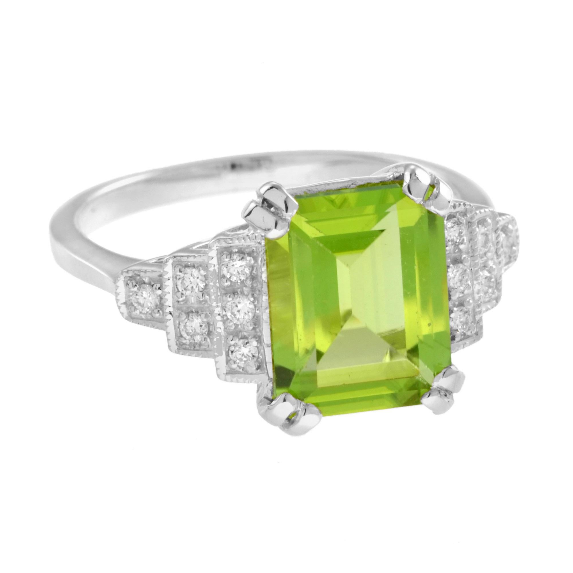 This gorgeous ring features a striking peridot set between step design diamonds set shoulders. With a total 12 diamonds, this exquisite ring is a wonderful addition to your fine jewelry collection.
14K White Gold. 
Ring Information
Style: Art Deco