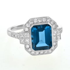 Rectangle Emerald Cut London Blue Topaz & Diamond Halo Engagement Platinum Ring