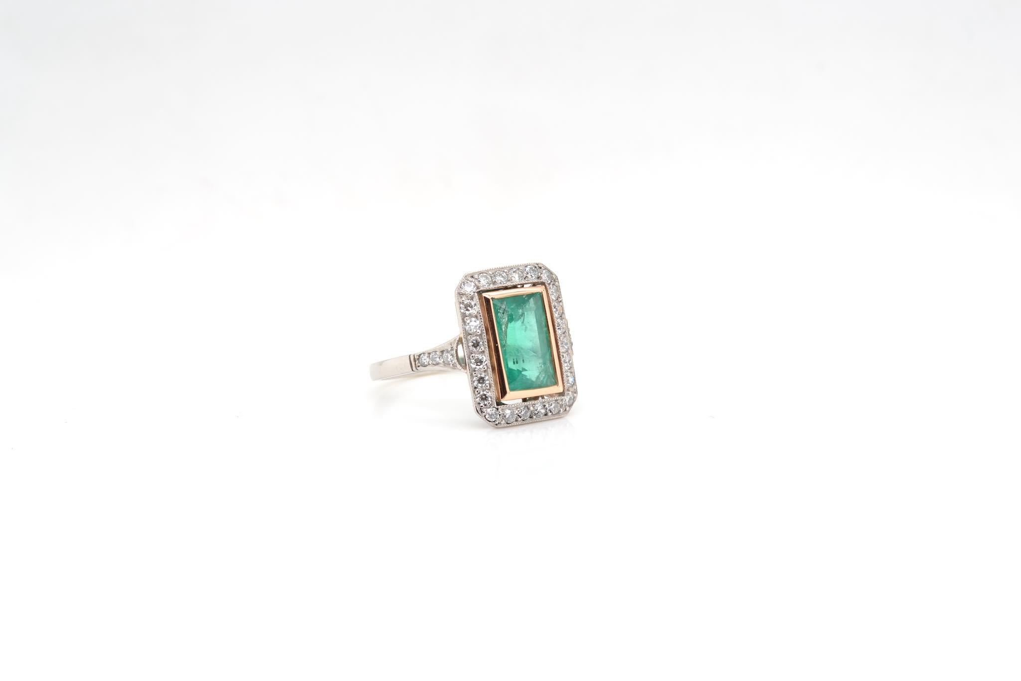 Art Deco Rectangle shaped ring set with an emerald For Sale