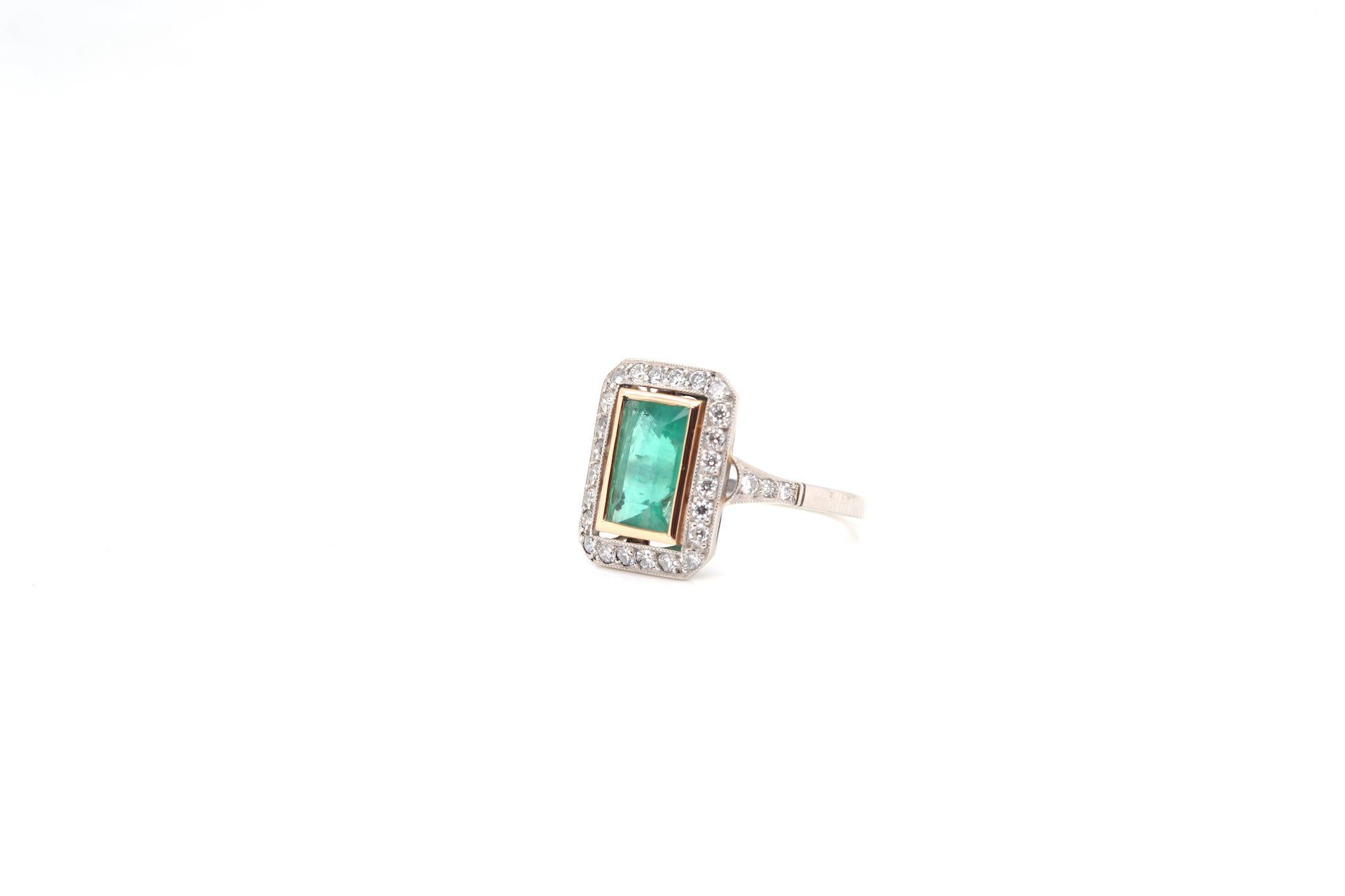 Emerald Cut Rectangle shaped ring set with an emerald For Sale