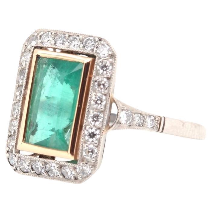 Rectangle shaped ring set with an emerald For Sale
