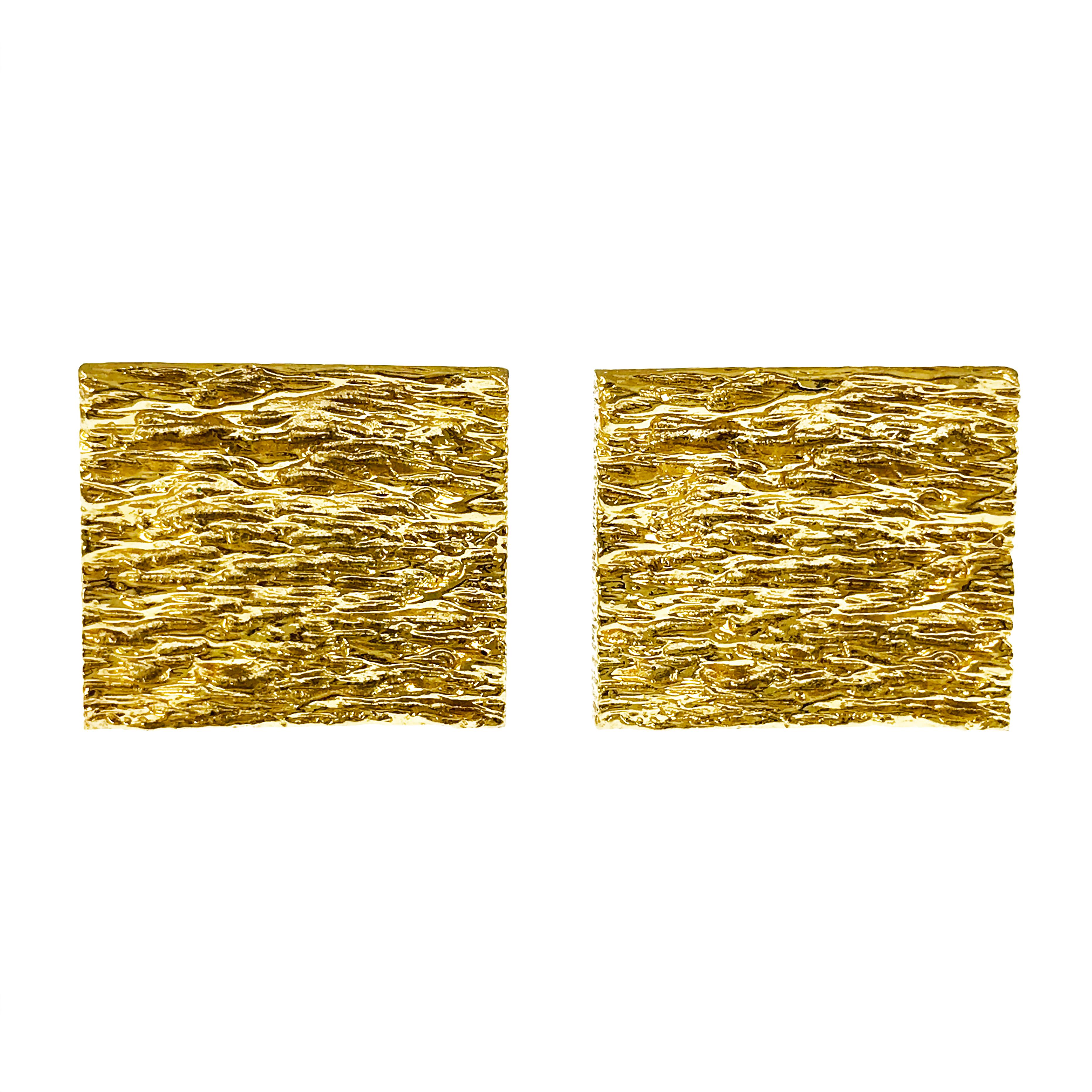 Rectangular 14k Yellow Gold Cufflinks. These highly textured bark finish cufflinks have a dual post and bullet backing. There is a slight concave to the fronts of the cufflinks. The cufflink fronts measure approximately 21.8mm by 18.9mm.

NOTE: 