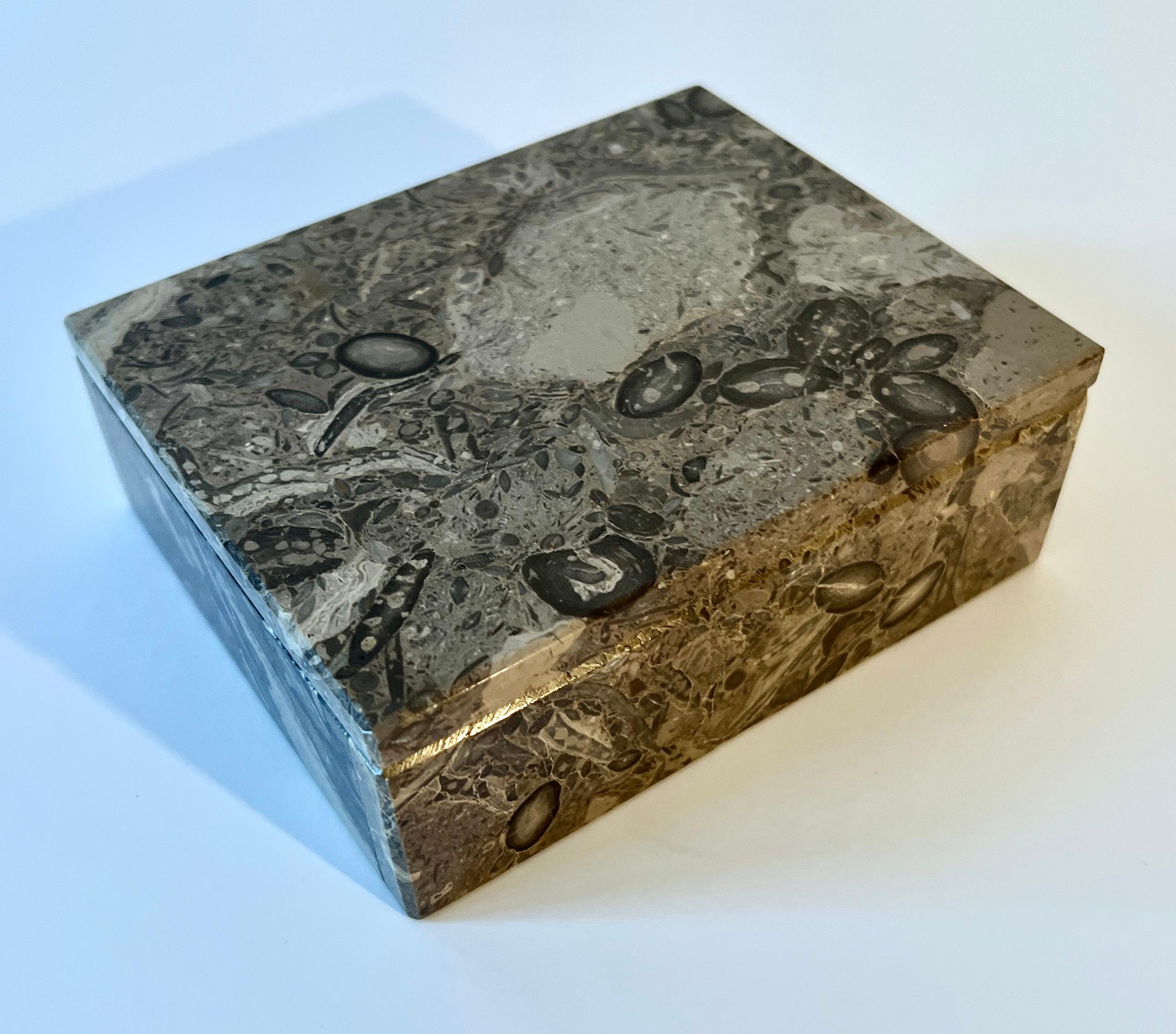 Alabaster Box in the brown tones.  The box has a lid that is independent from the box and lifts off, not on a hinge.

A compliment to the cocktail table for candy or nuts, the desktop or work station for office supplies such as paper clips or rubber