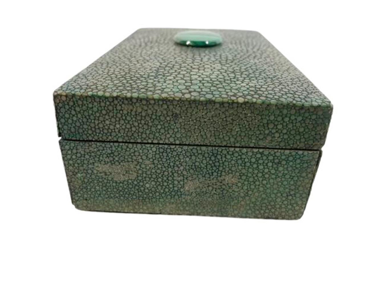 Art Deco green stained shagreen, over cedar, the slightly domed top with a centered oval malachite disk. The box is covered with shagreen on all sides including the bottom.