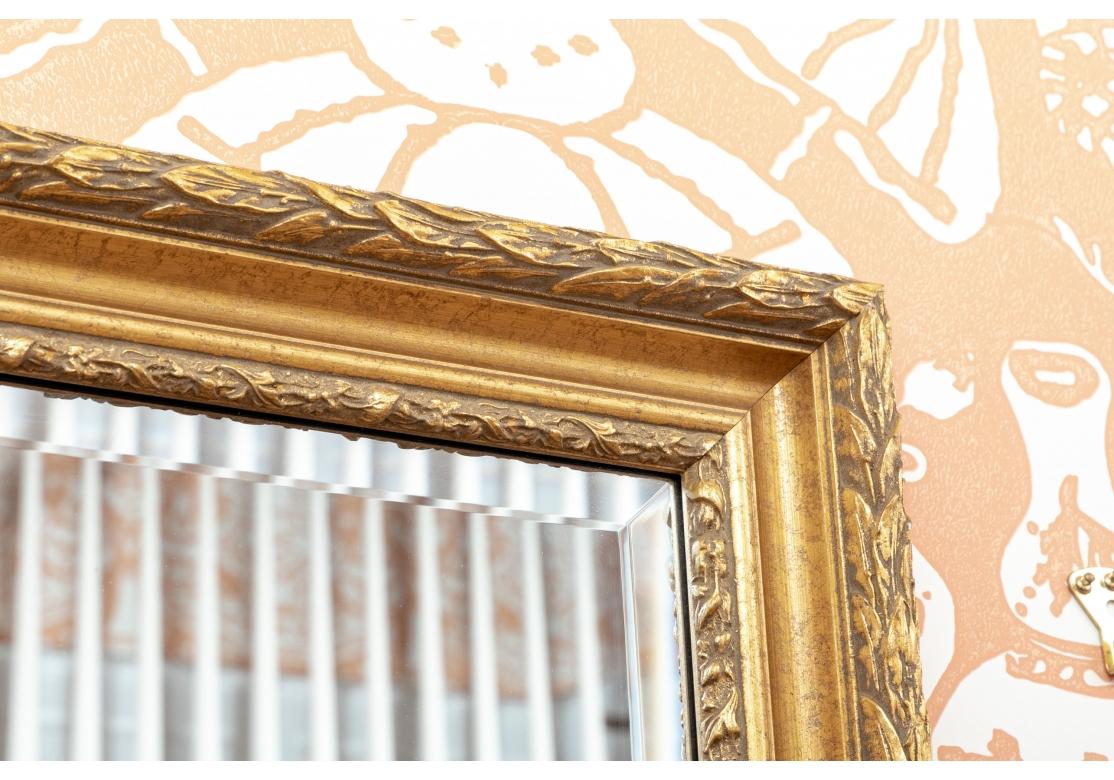 Giltwood Rectangular Beveled Gilt Mirror With Carved Laurel Leaves For Sale