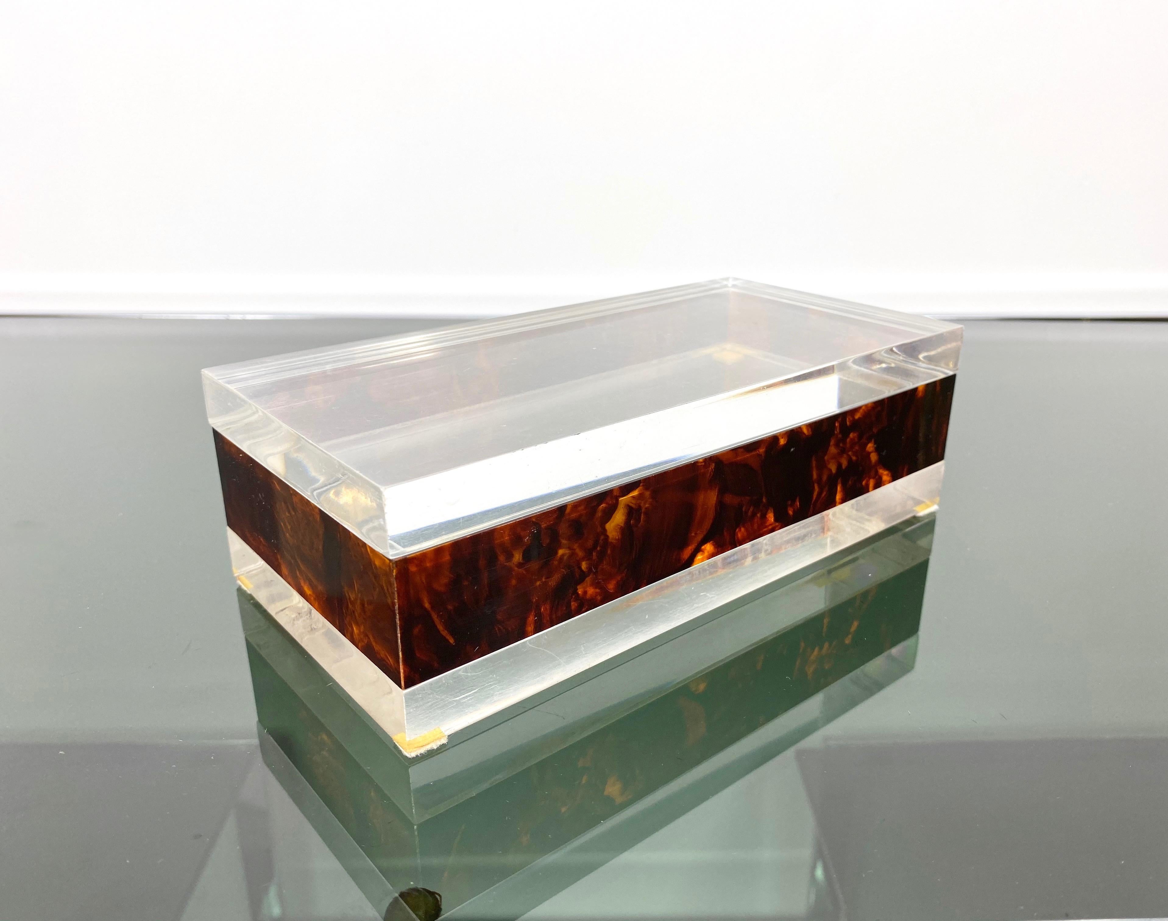 Lucite decorative box in a rectangular shape, featuring faux tortoiseshell Lucite details and a transparent, lucite cover. A typical example of Italian 1970s design.
