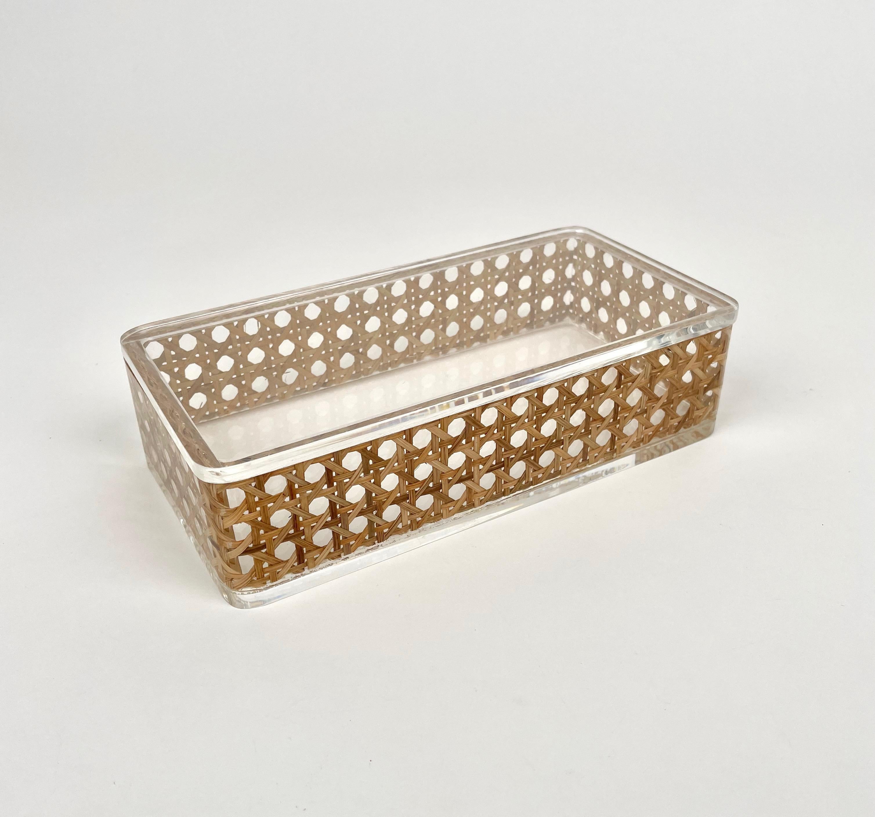 Rectangular box in lucite and rattan in the style of Christian Dior Home. 

Made in Italy in the 1970s.
