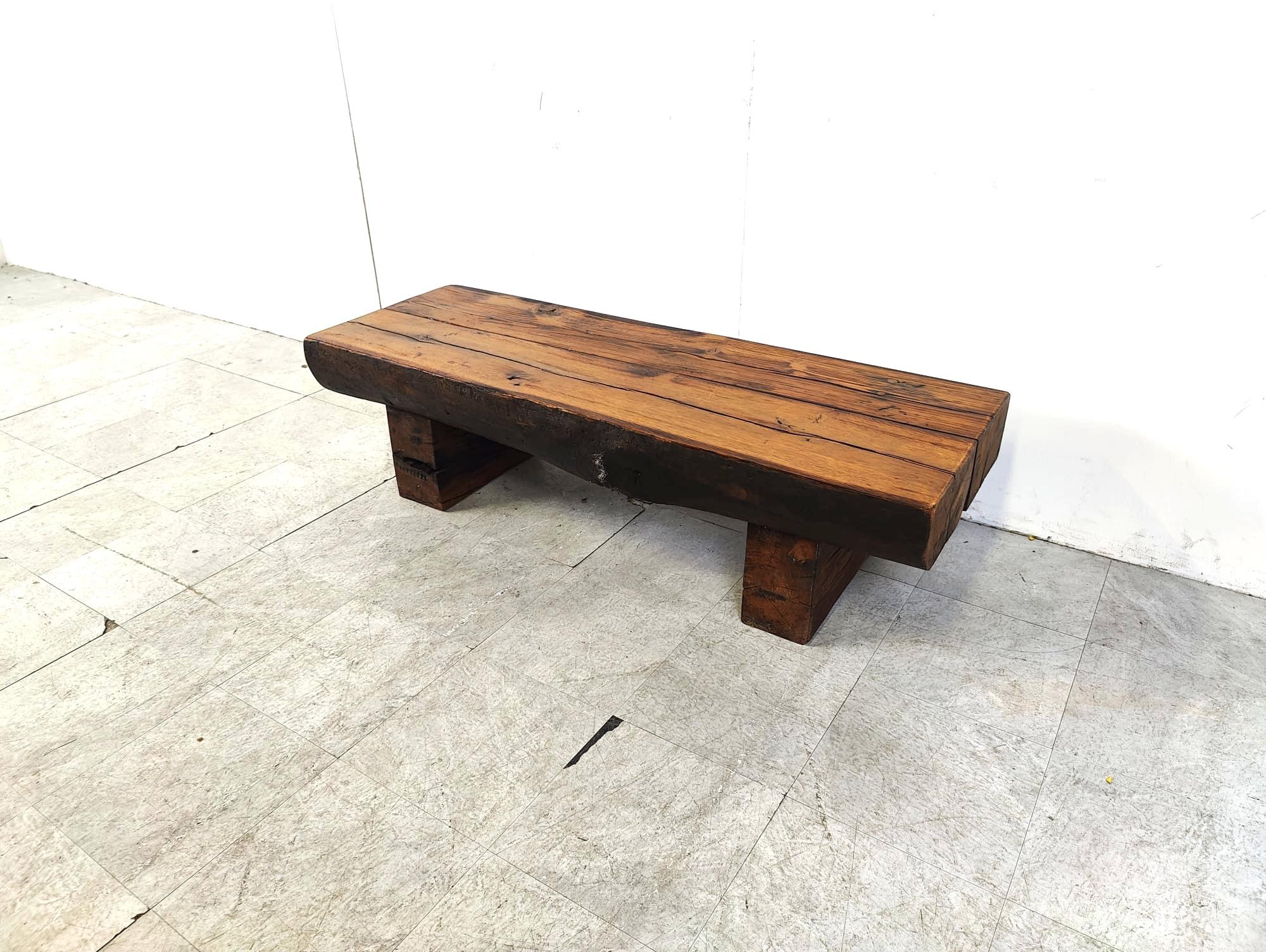 Solid wooden rectangular brutalist coffee table on a two legged base.

Beautiful patina which adds to the character of the piece.

Great solid piece to contrast a light and modern interior.

1950s - France

Dimensions:
Height: 38cm
Width: