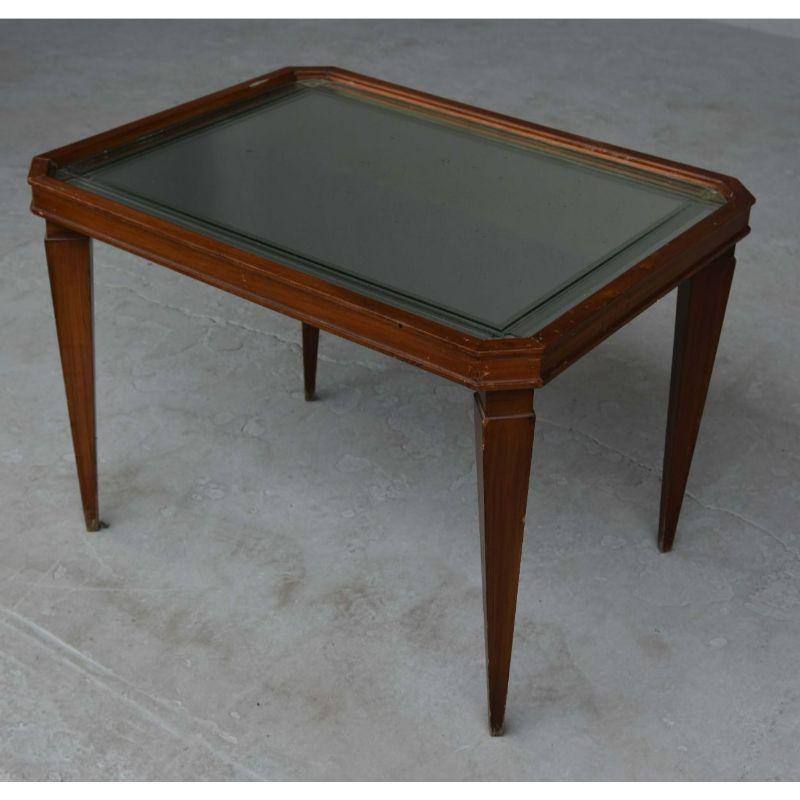Rectangular coffee table from the 40s, mirror and mahogany, height dimension 46 cm for a tray size of 62 cm by 48 cm.

Additional information:
Style: Vintage 1970
Material: Mahogany, glass & crystal.